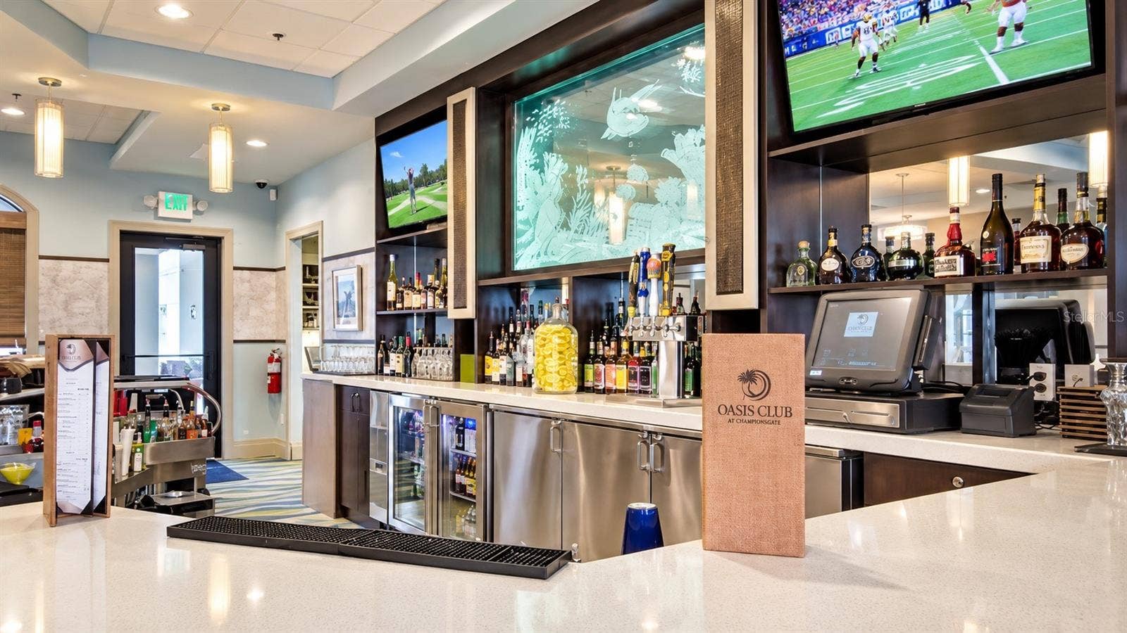 1516 BUNKER DRIVE, Davenport, FL 33896 Oasis Club at ChampionsGate features a full-service bar and casual gathering space for residents and guests.