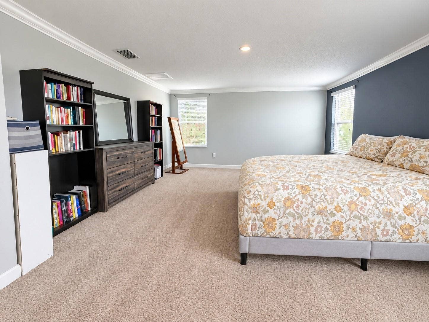 1516 BUNKER DRIVE, Davenport, FL 33896 Spacious primary bedroom featuring abundant natural light and a large walk-in his and hers closet.