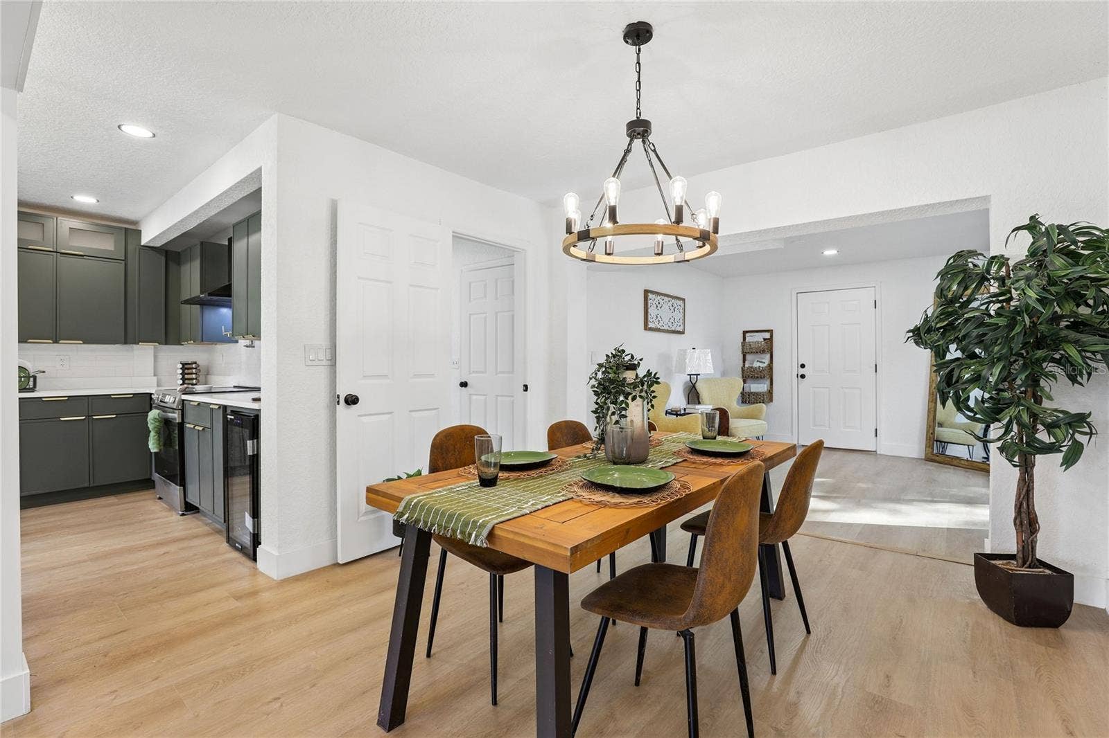 1718 CAMPBELL AVENUE, Orlando, FL 32806 Open dining area connects seamlessly to the kitchen and living spaces