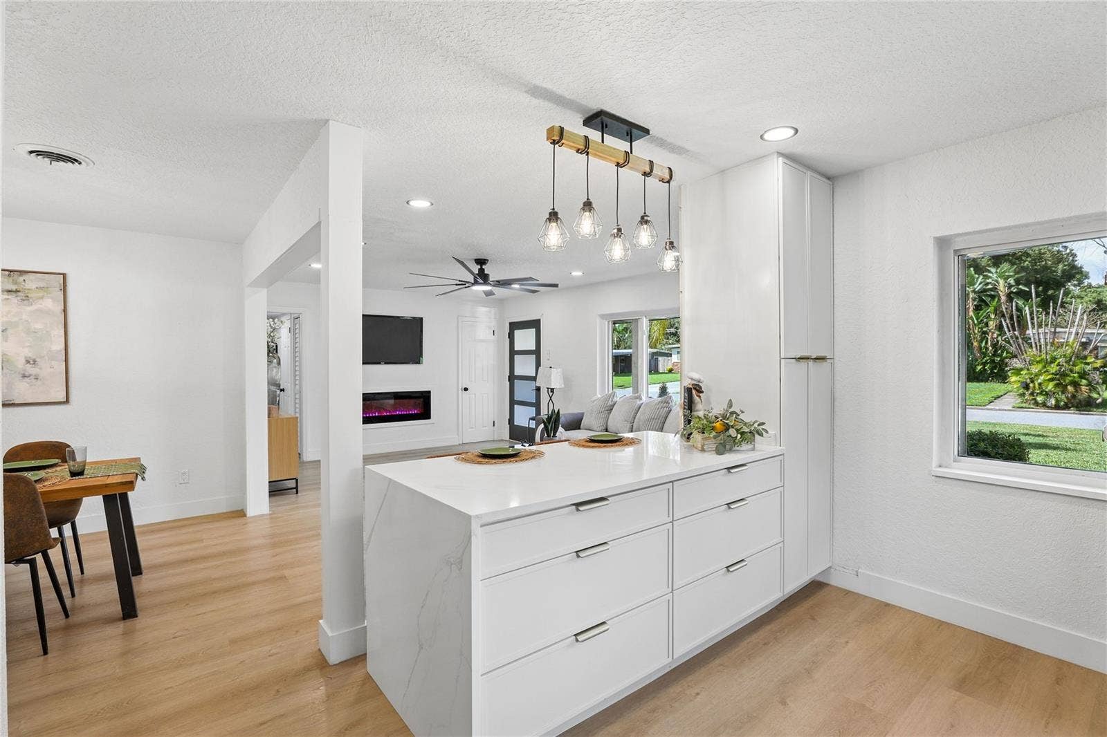 1718 CAMPBELL AVENUE, Orlando, FL 32806 The heart of the home redesigned kitchen with waterfall-edge island