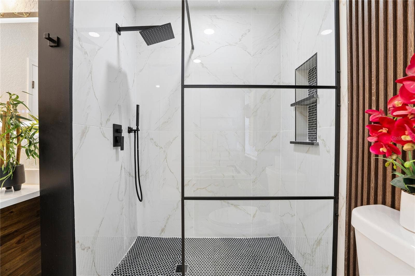 1718 CAMPBELL AVENUE, Orlando, FL 32806 Separate glass-enclosed walk-in shower with rainfall showerhead