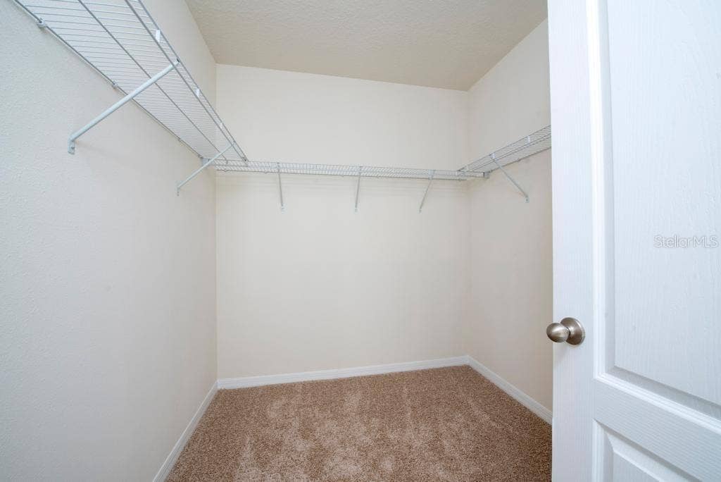 2723 SUNKISSED DRIVE, St Cloud, FL 34771 Master Bedroom Walk-in closet