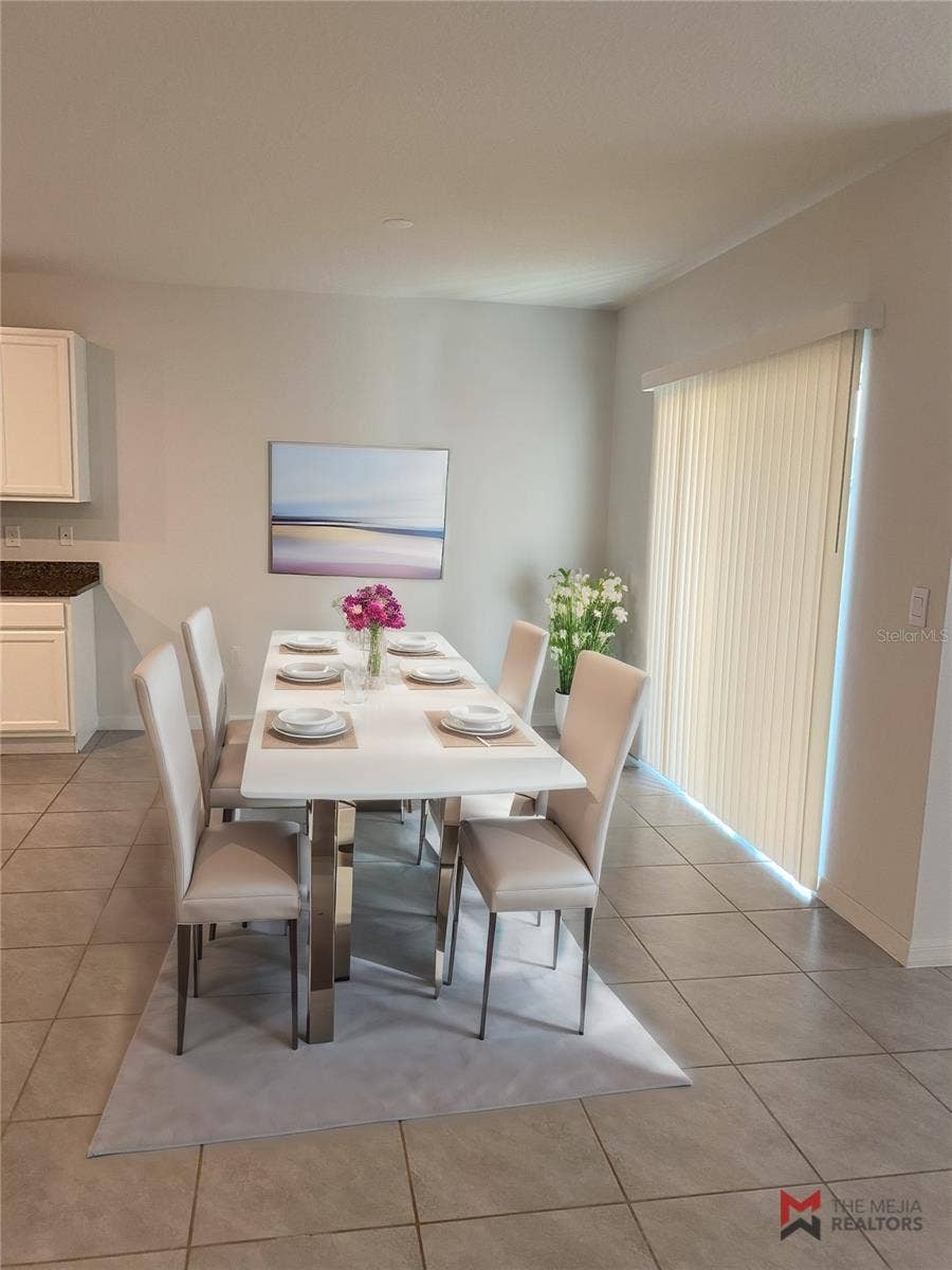 2723 SUNKISSED DRIVE, St Cloud, FL 34771 Staged dining room