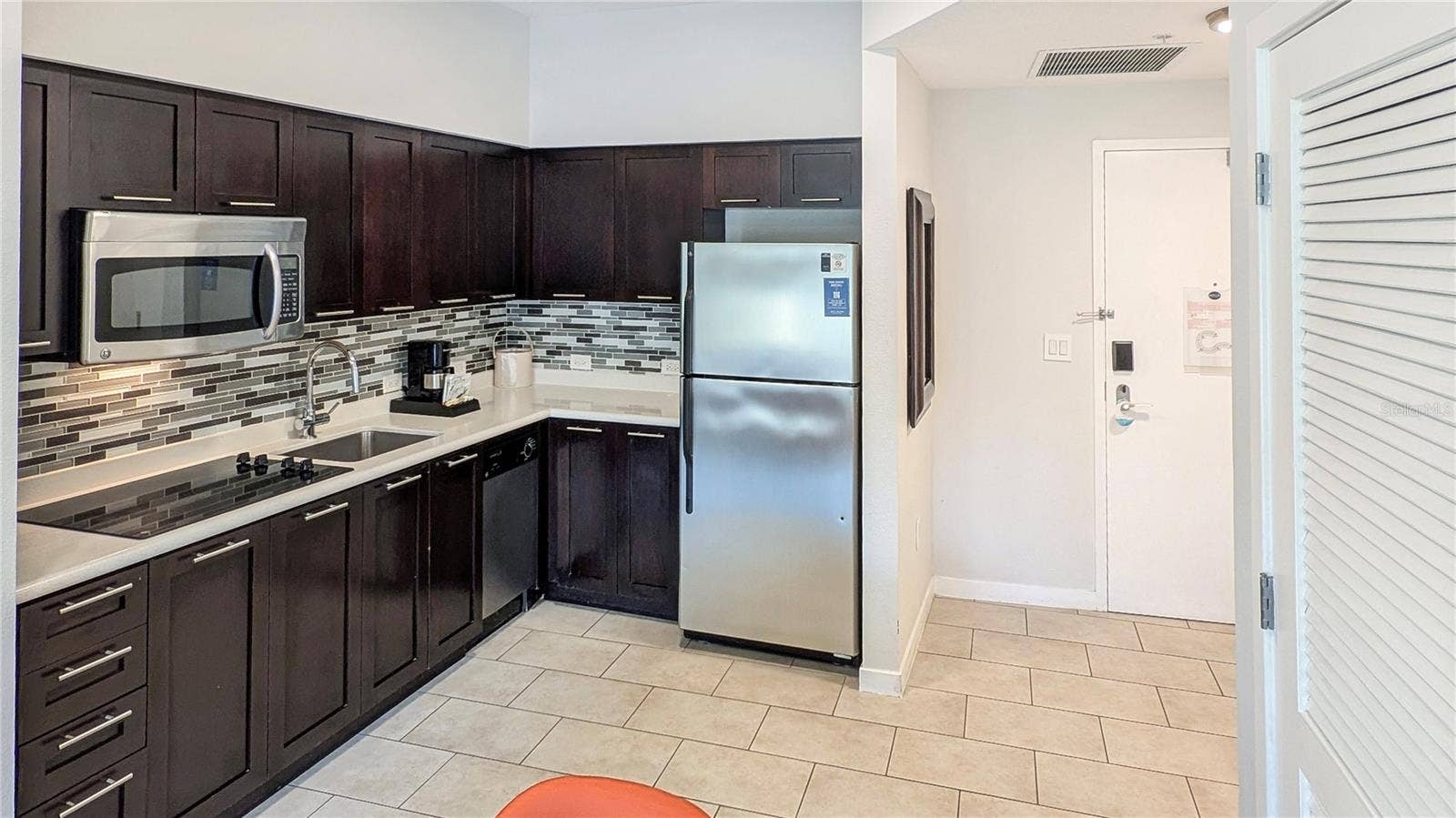 225 CELEBRATION PLACE, #212, Kissimmee, FL 34747 Kitchen and Front Entry!