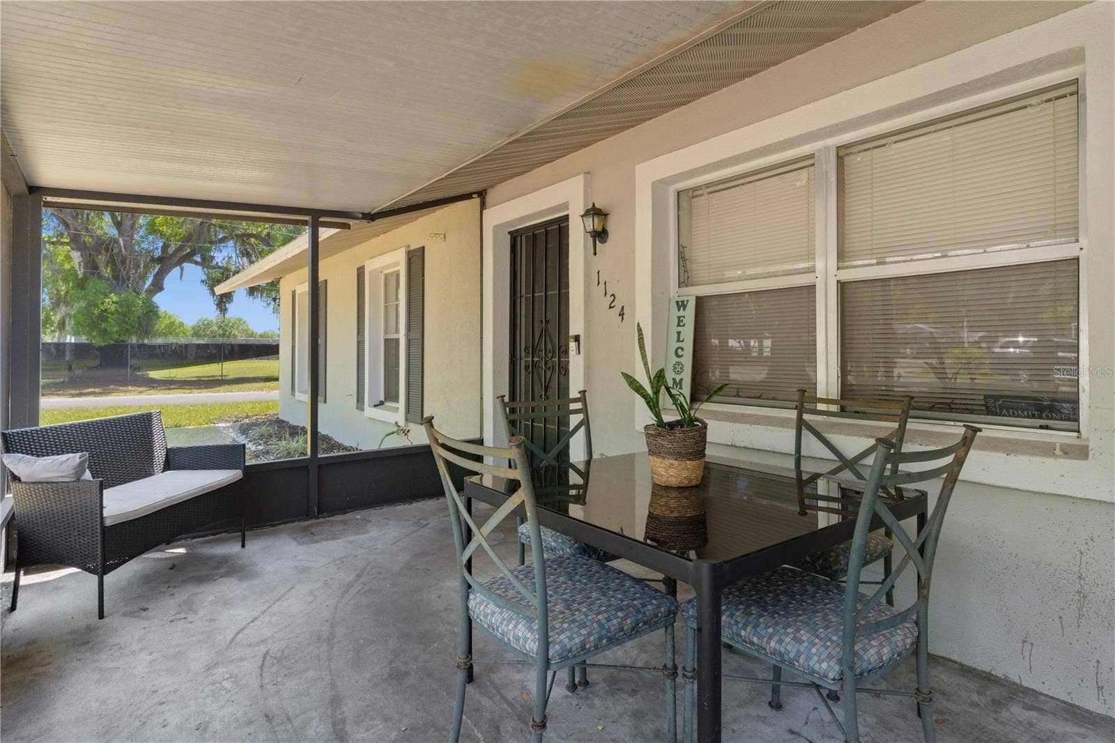 1124 N GRANT AVENUE, Mount Dora, FL 32757 screened front porch