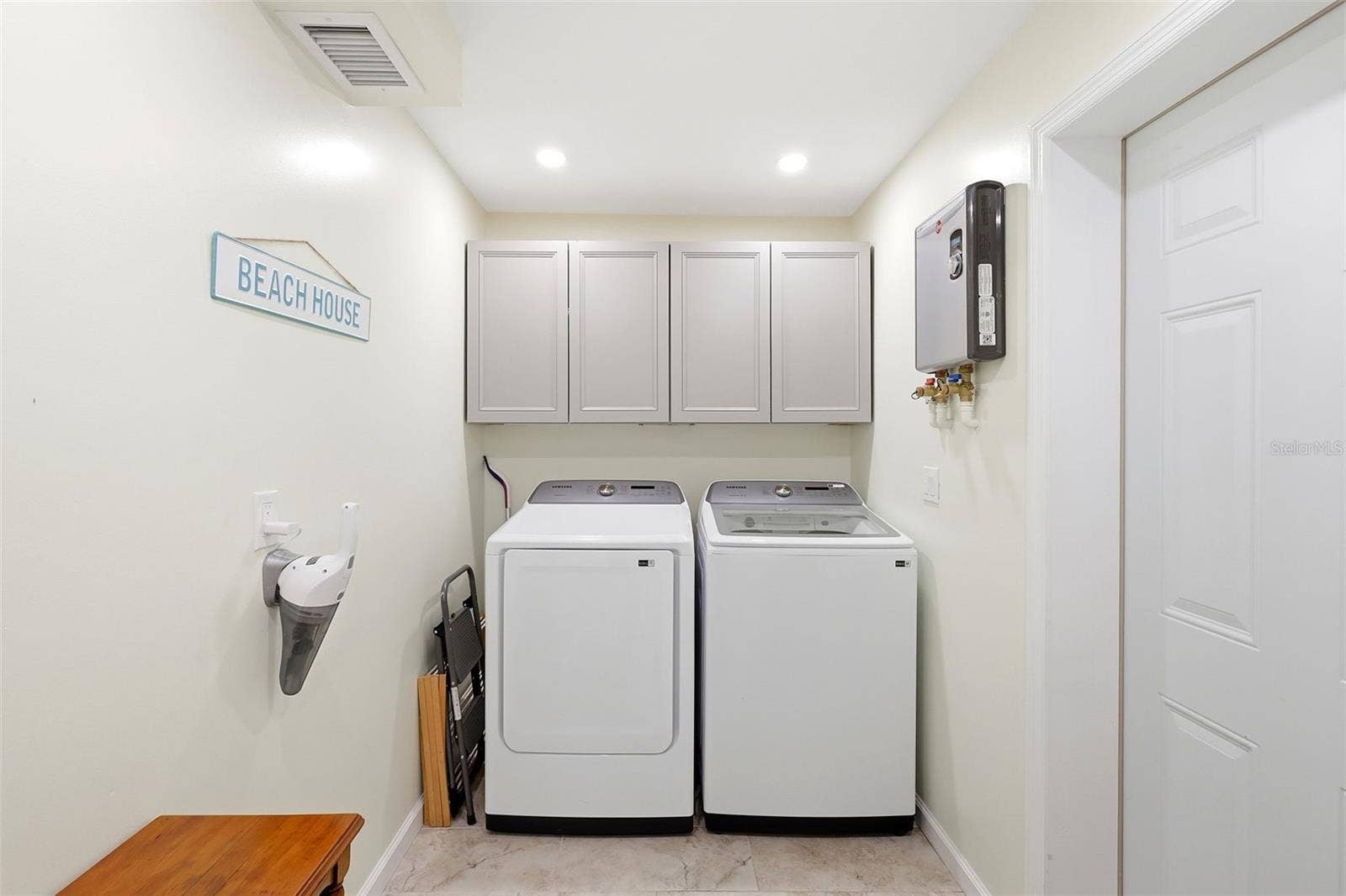159 LAURIE DRIVE, Ormond Beach, FL 32176 Laundry with tankless water heater