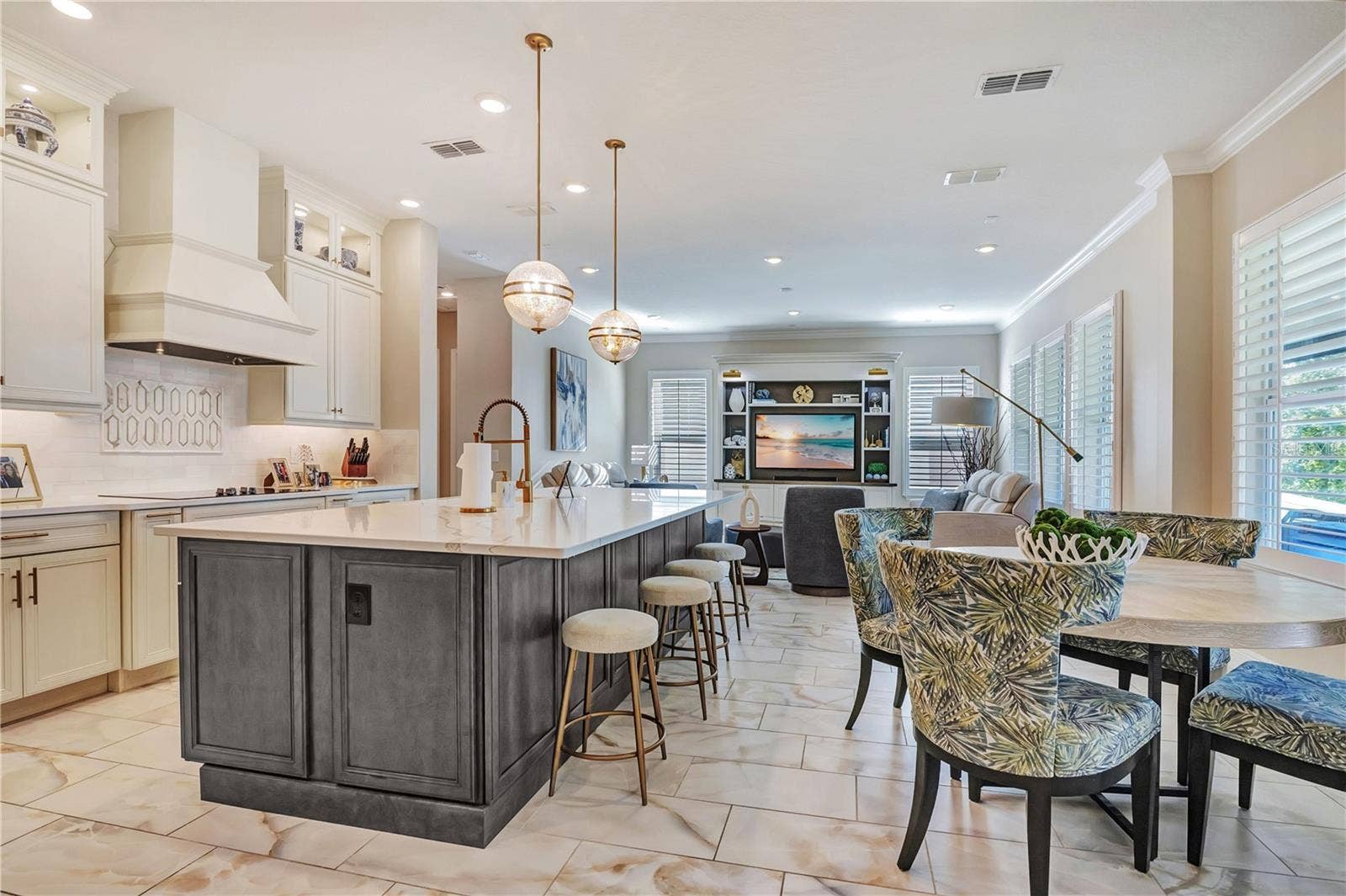 17600 LAKE STAR ROAD, Winter Garden, FL 34787 Open kitchen layout connects the island, breakfast nook and family room for everyday living and entertaining.