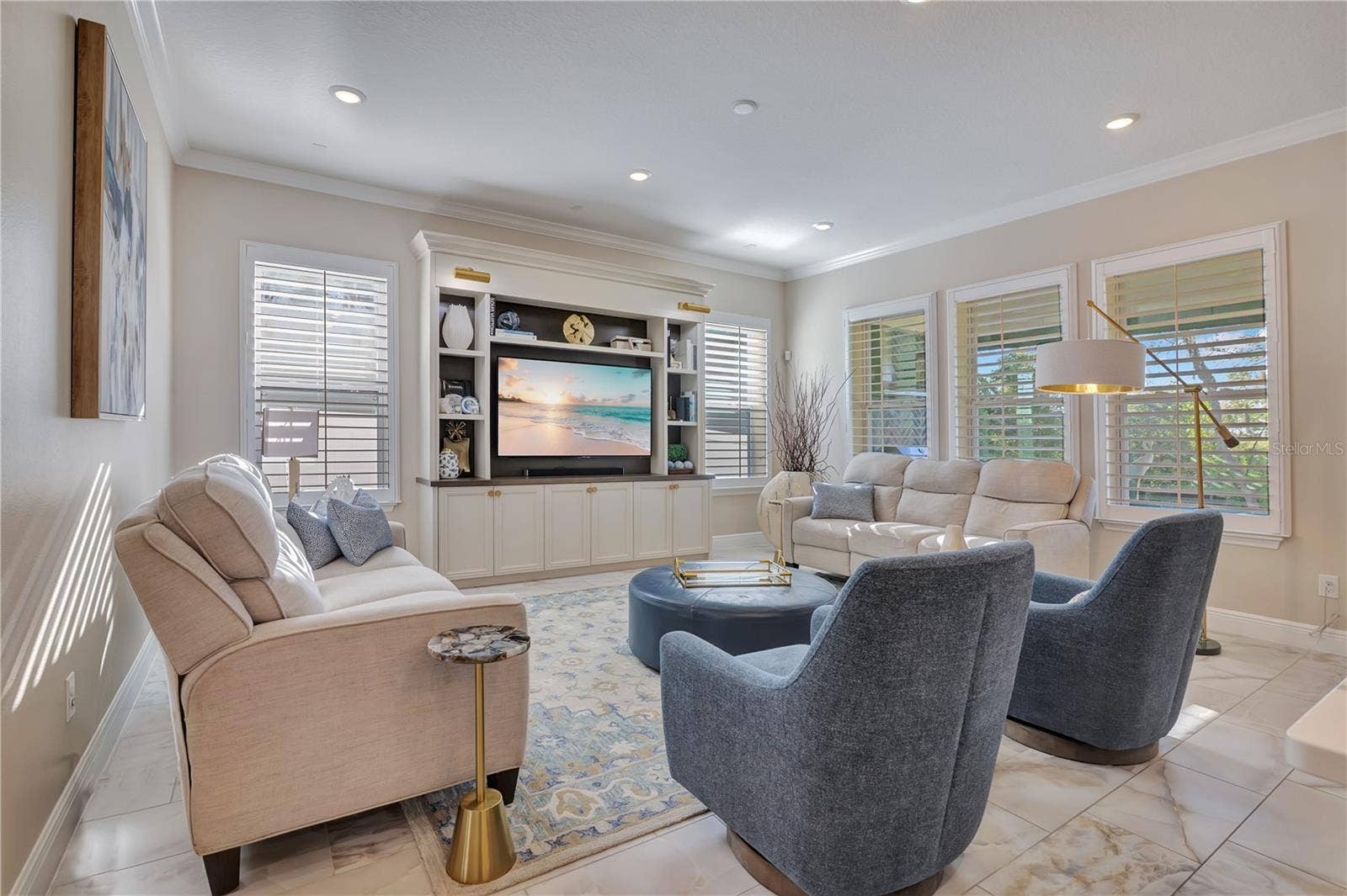 17600 LAKE STAR ROAD, Winter Garden, FL 34787 Bright family room with multiple windows and an open layout offers comfortable space for relaxing and entertaining.