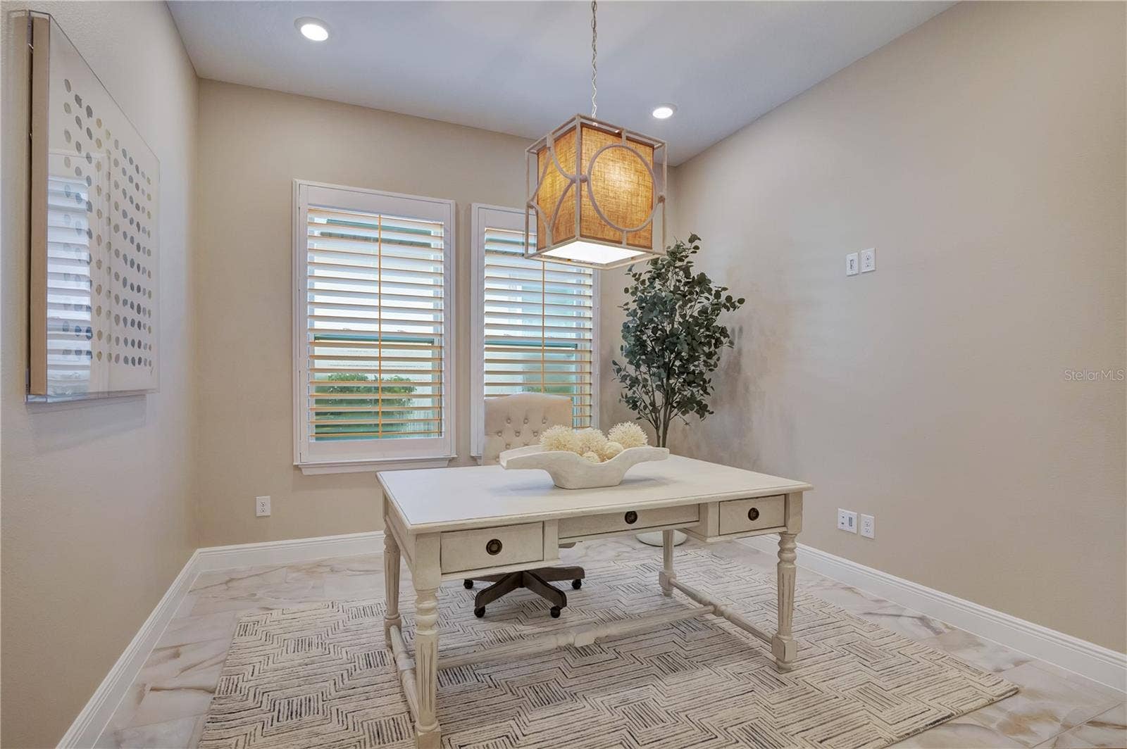 17600 LAKE STAR ROAD, Winter Garden, FL 34787 Dedicated office featuring plantation shutters, recessed lighting and a decorative pendant fixture.