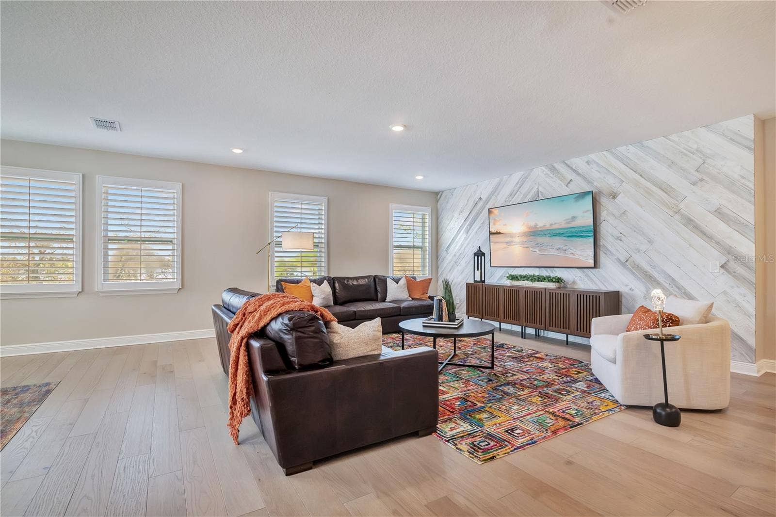 17600 LAKE STAR ROAD, Winter Garden, FL 34787 Spacious loft featuring a statement accent wall, recessed lighting and plantation shutters.