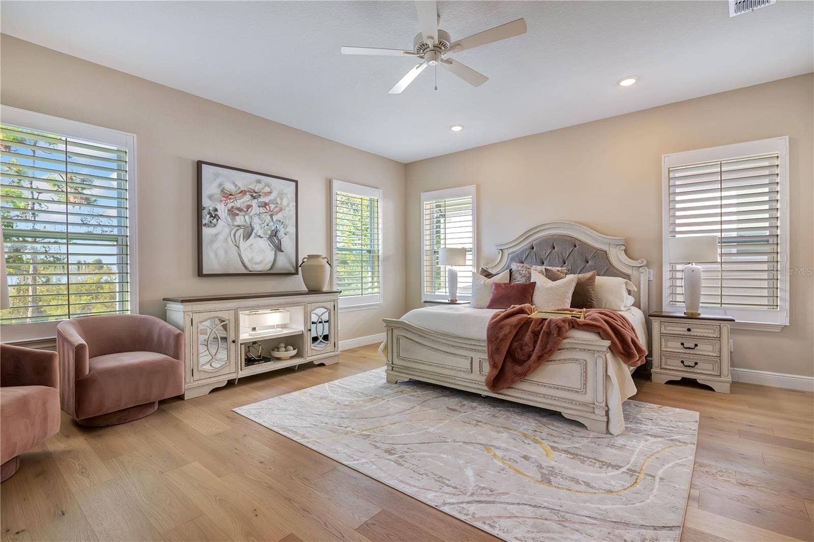 17600 LAKE STAR ROAD, Winter Garden, FL 34787 Spacious master featuring hardwood flooring, plantation shutters and abundant natural light, with room for a sitting area.