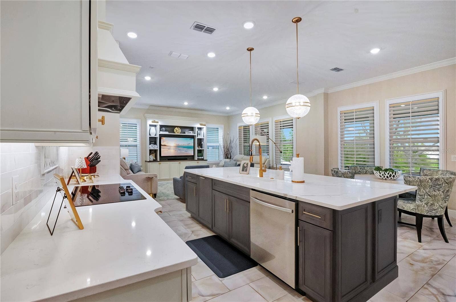 17600 LAKE STAR ROAD, Winter Garden, FL 34787 Expansive kitchen island features an undermount sink, built-in dishwasher and generous preparation space.
