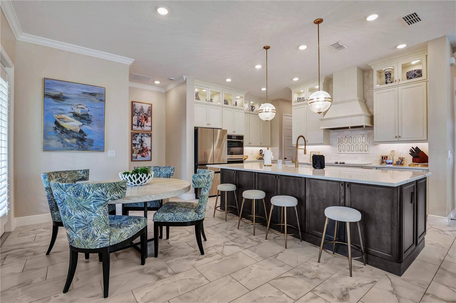 17600 LAKE STAR ROAD, Winter Garden, FL 34787 Breakfast nook and generous island seating provide multiple spaces for casual dining and gathering.