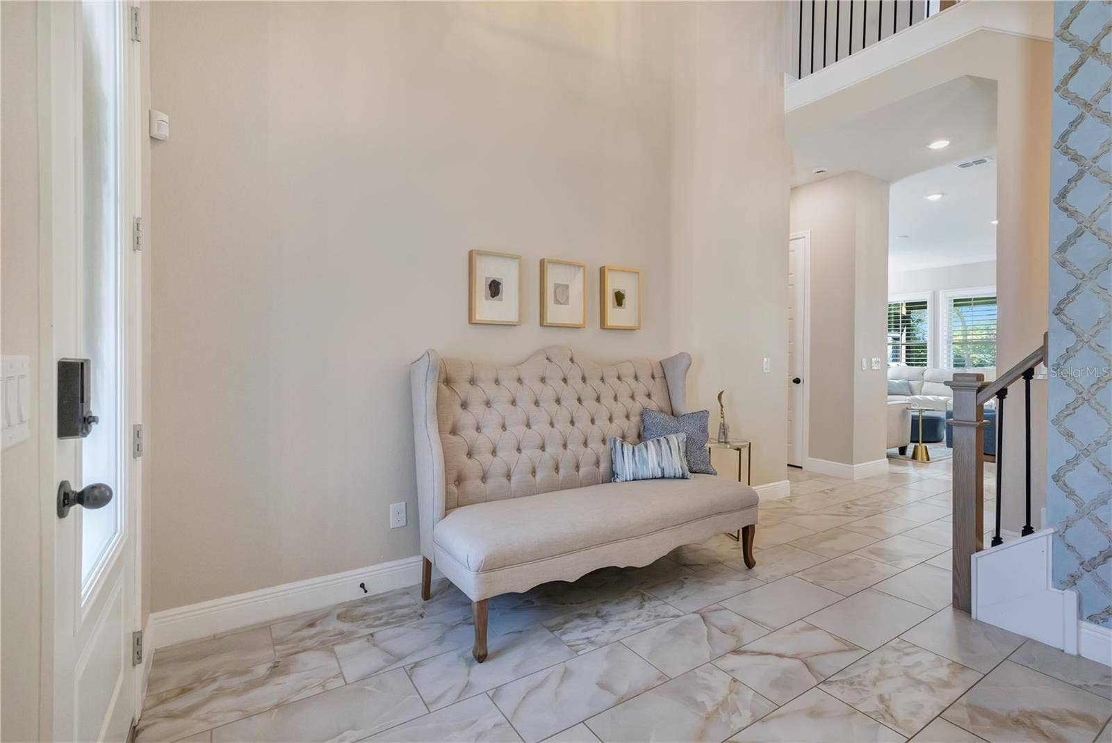 17600 LAKE STAR ROAD, Winter Garden, FL 34787 Bright foyer with soaring ceilings and upgraded tile flooring creates an inviting first impression.