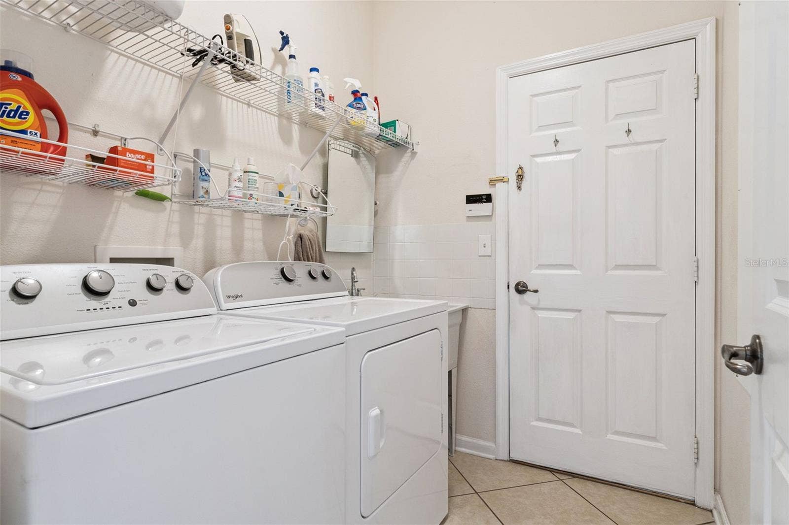 108 AVENHAM DRIVE, Deland, FL 32724 5'6" x 7' Utility Room w/ a laundry tub, washer, electric dryer & a natural gas connection for a future use