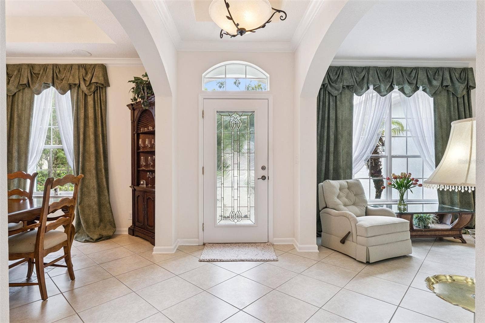 108 AVENHAM DRIVE, Deland, FL 32724 Foyer entryway w/ leaded glass front door, tray ceiling & crown molding