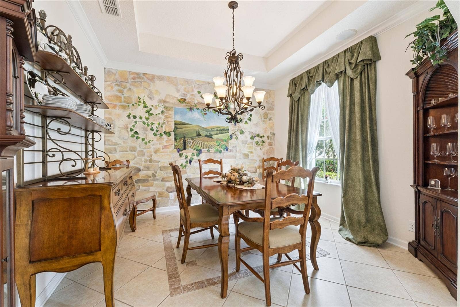 108 AVENHAM DRIVE, Deland, FL 32724 11'6" x 12' Dining Room w/ tray ceiling, crown molding & a decorative tile border & accent wall