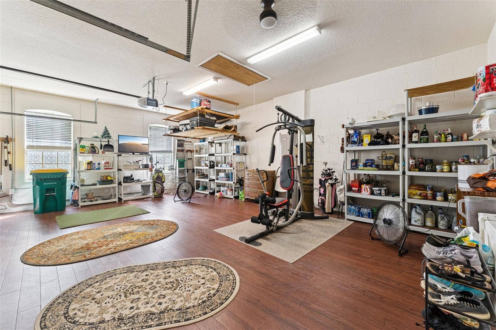 108 AVENHAM DRIVE, Deland, FL 32724 25'6" x 19'9" Garage w/ engineered wood flooring, insulated garage door, pull down attic stairs, ceiling fan & additional electrical outlets
