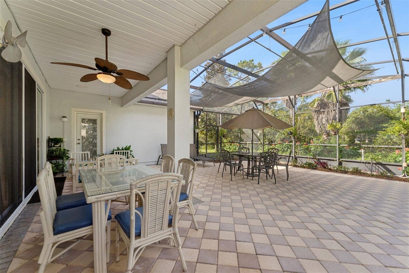 108 AVENHAM DRIVE, Deland, FL 32724 30' x 32' Screen enclosed covered patio w/ brick pavers, awning, ceiling fan & lighting