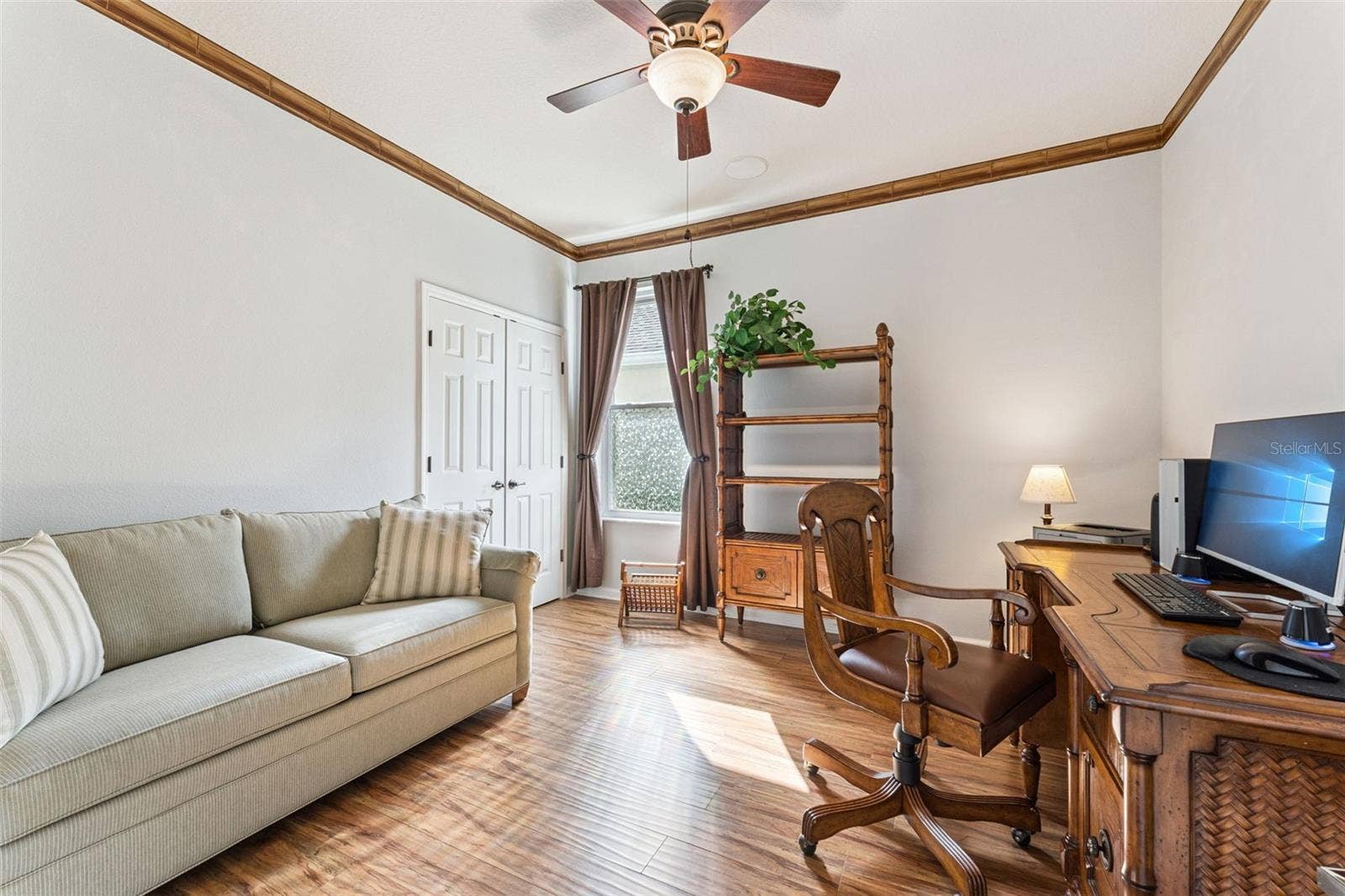 108 AVENHAM DRIVE, Deland, FL 32724 11'6" x 12' Bedroom #2 w/ engineered wood flooring, ceiling fan, surround sound speakers & a double door entry