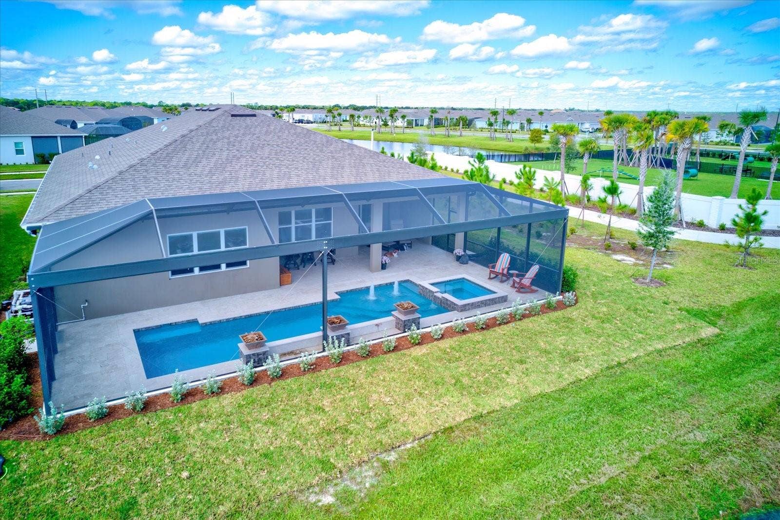 9177 SPLASHING DRIVE, Melbourne, FL 32940 Expansive Travertine tiled Lanai
