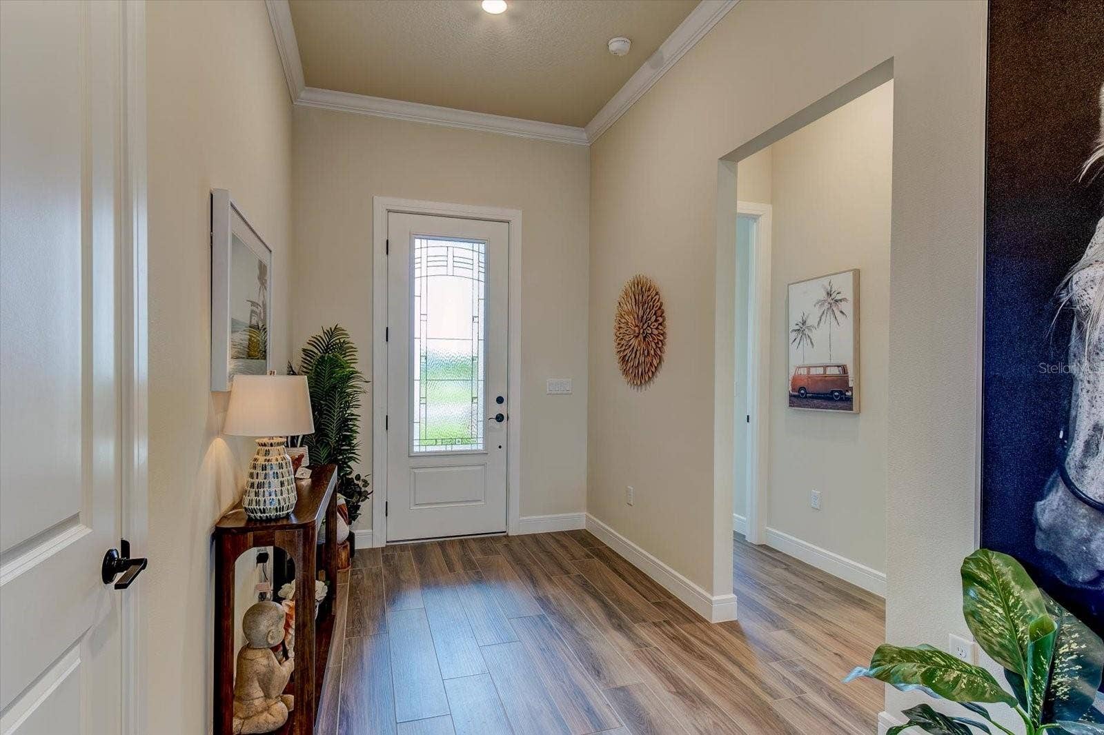 9177 SPLASHING DRIVE, Melbourne, FL 32940 Foyer to Bedroom and Half Bath