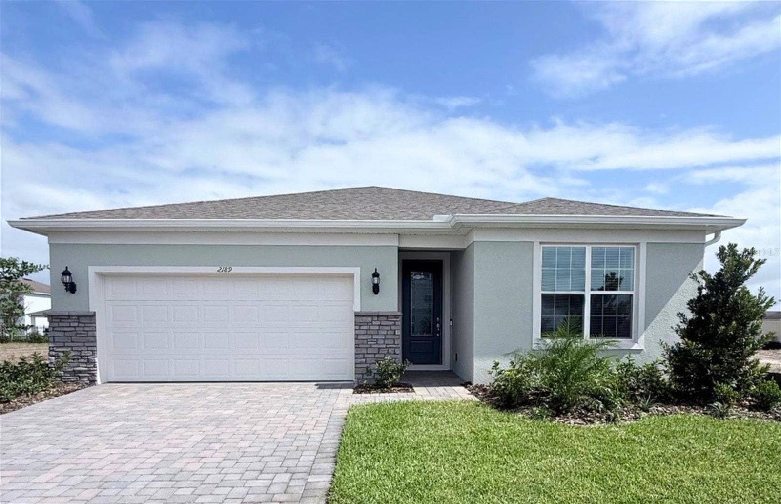 2189 MOSSY VINE AVENUE, St Cloud, FL 34771 Exterior Design. Artistic rendering for this new construction home. Pictures are for illustrative purposes only. Elevations, colors and options may vary.
