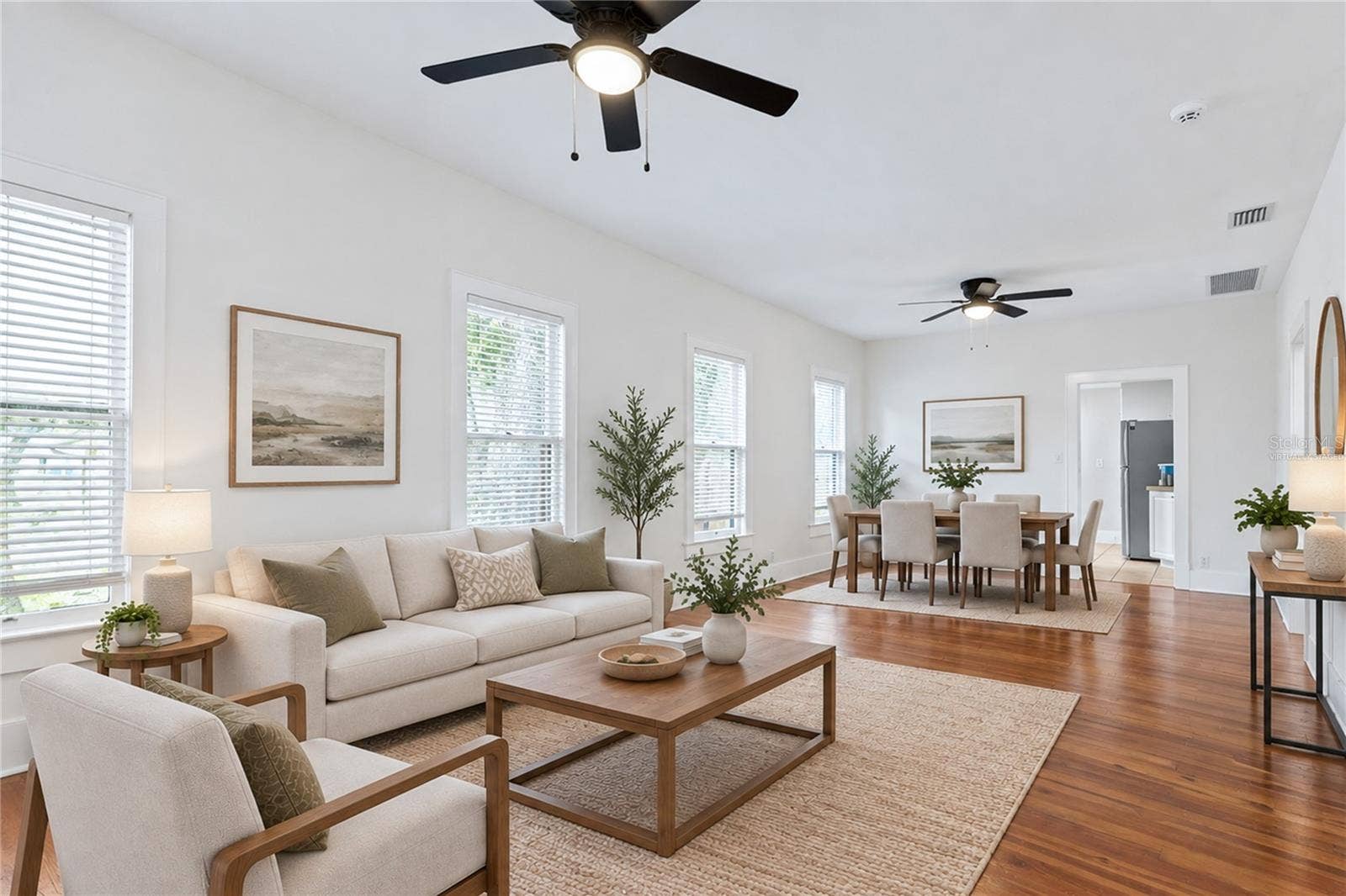 12 N FOREST AVENUE, Orlando, FL 32803 Virtually staged image. Living Room and Dining.