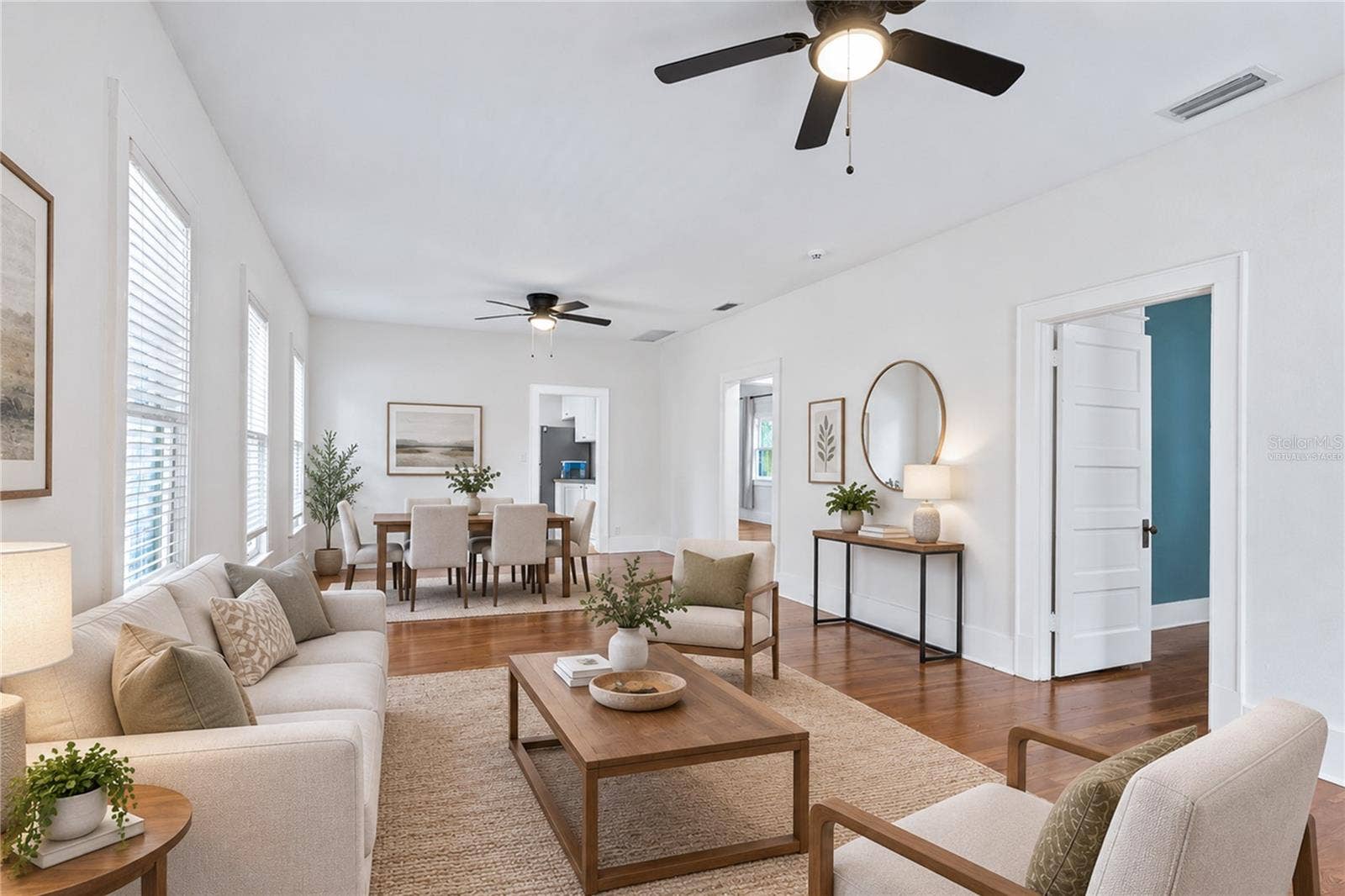 12 N FOREST AVENUE, Orlando, FL 32803 Virtually staged image. Living Room and Dining.