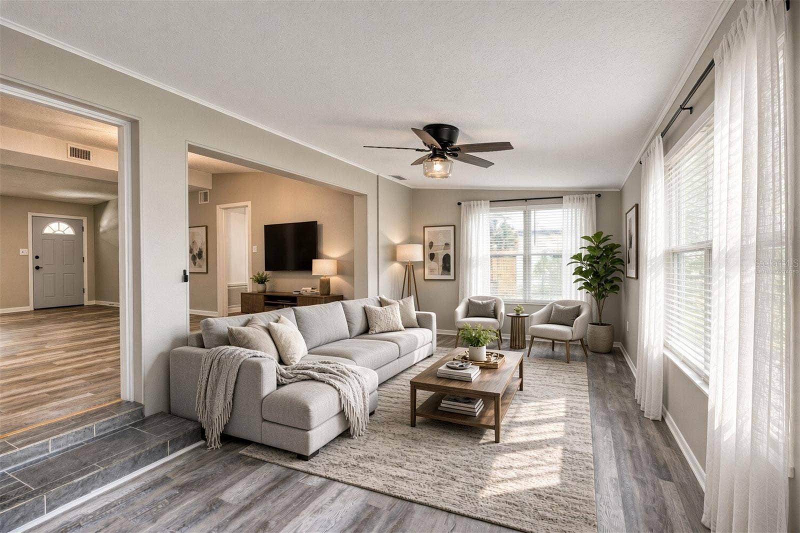 1712 EDMUNDSHIRE ROAD, Orlando, FL 32812 Virtually Staged. Family Room.