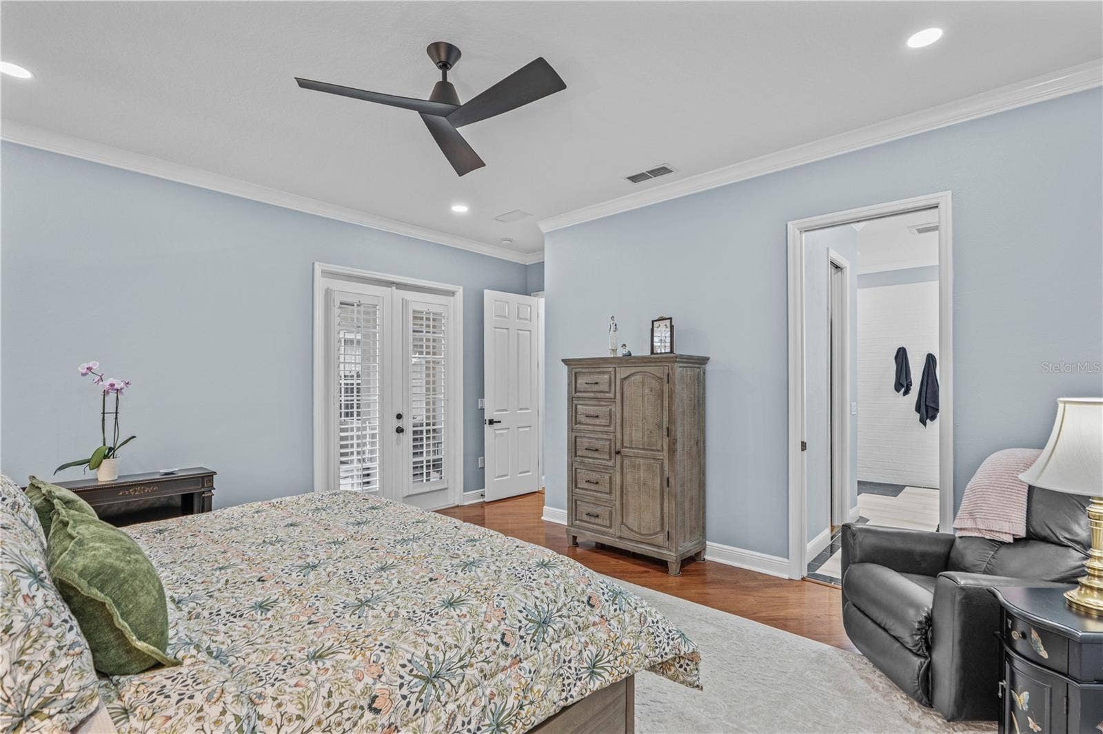 520 SOTHEBY WAY, Debary, FL 32713 Looking toward the entrance to the primary bedroom-- and showing the French doors to the lanai