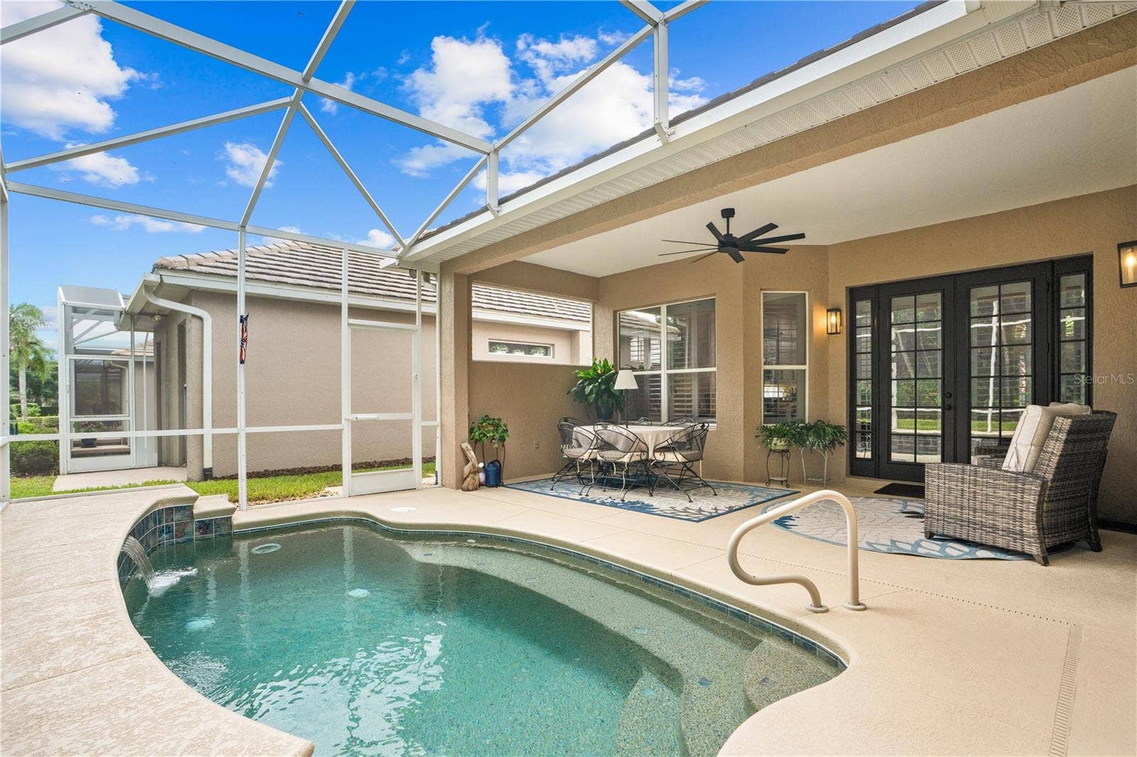 520 SOTHEBY WAY, Debary, FL 32713 Lots of privacy on the back porch/lanai area; The exterior wall next to the table is plumbed for natural gas for installation of summer kitchen