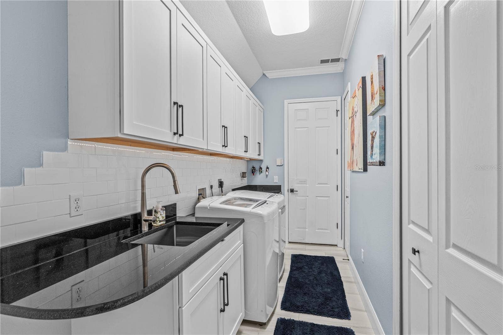 520 SOTHEBY WAY, Debary, FL 32713 Renovated laundry room with tons more storage and granite counters; The "utility" sink-- which seems anything but utilitarian-- is stainless steel and extra deep