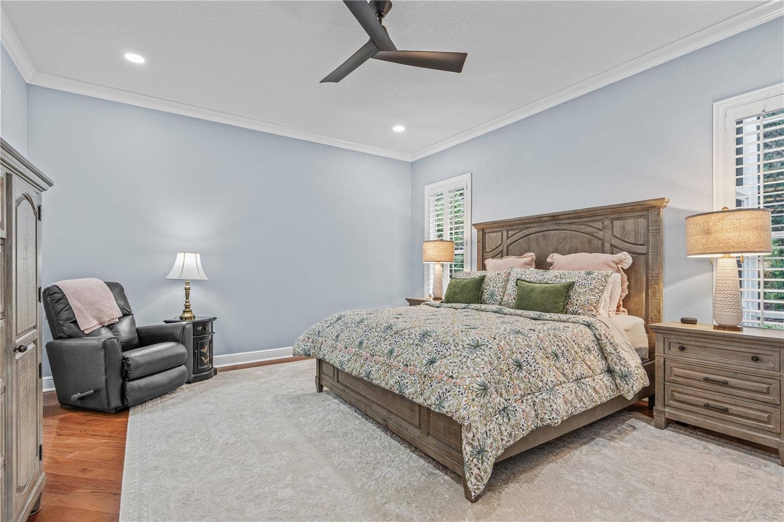 520 SOTHEBY WAY, Debary, FL 32713 Hardwood floors extend to the primary bedroom; Additional can lights were added as well as an updated ceiling fan during the 2024 renovations