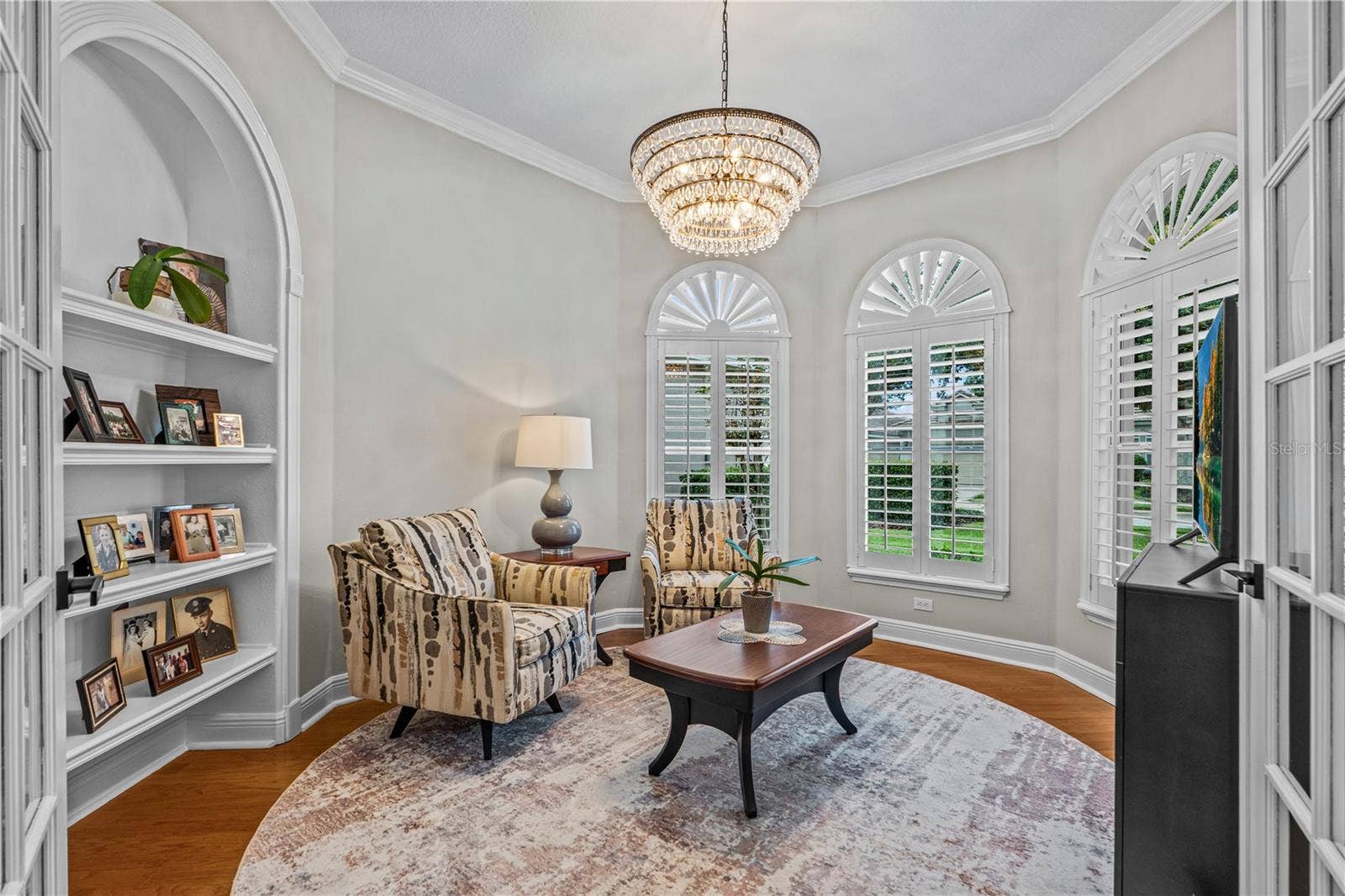520 SOTHEBY WAY, Debary, FL 32713 Currently used as a den, this would also make a great office with the built-in shelves; With all the windows, it's always light and bright