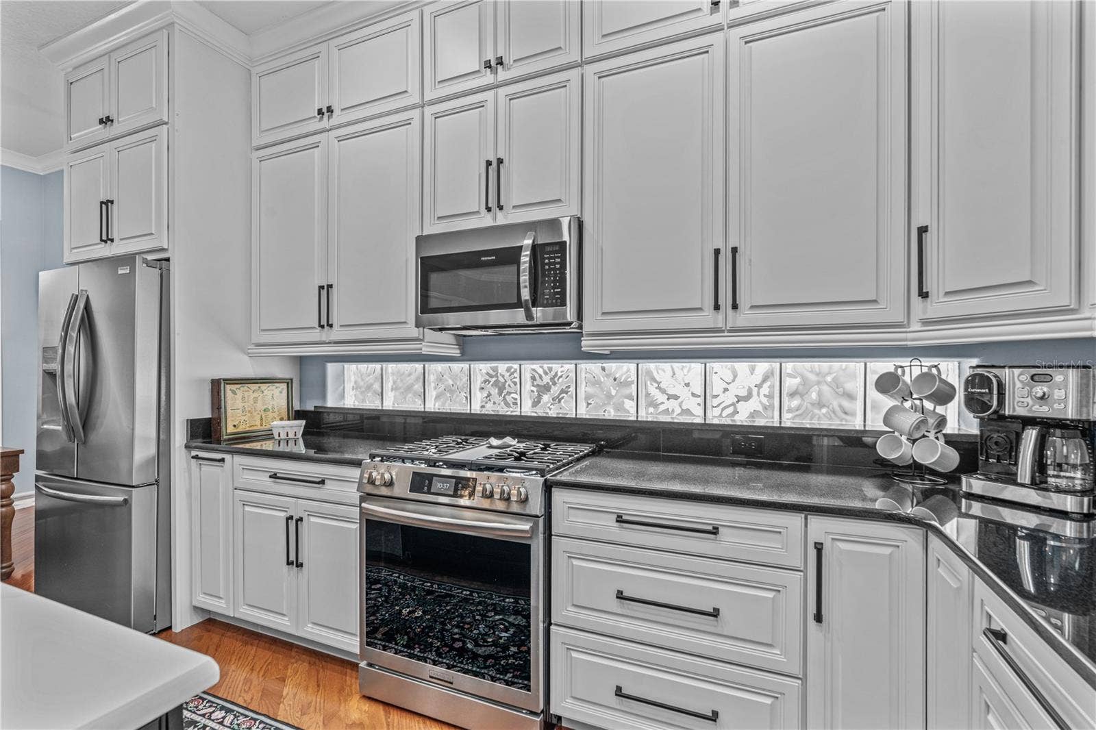 520 SOTHEBY WAY, Debary, FL 32713 All the cabinets in the home are solid wood and custom made with soft close doors and drawers. The extra high cabinets take advantage of every inch of those 10ft ceilings and are great for storing seasonal items