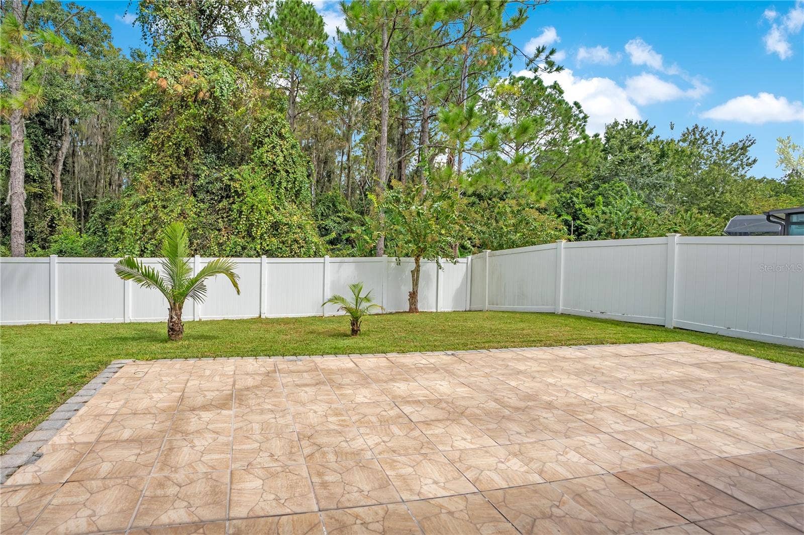 5762 COVINGTON COVE WAY, Orlando, FL 32829 extended patio / fenced in yard