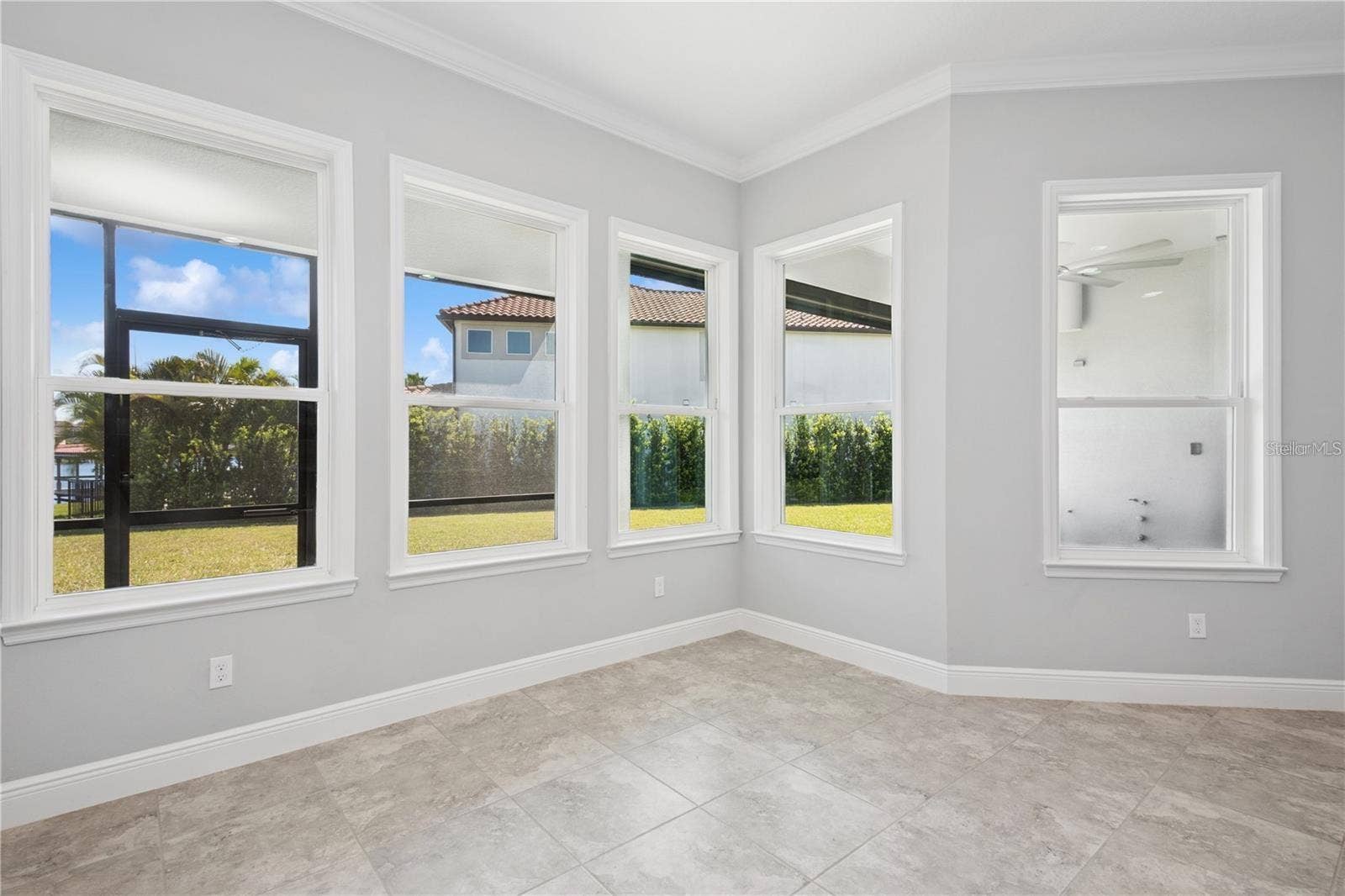 7031 BILLIE COURT, Winter Garden, FL 34787 View from dinette to patio, windows everywhere