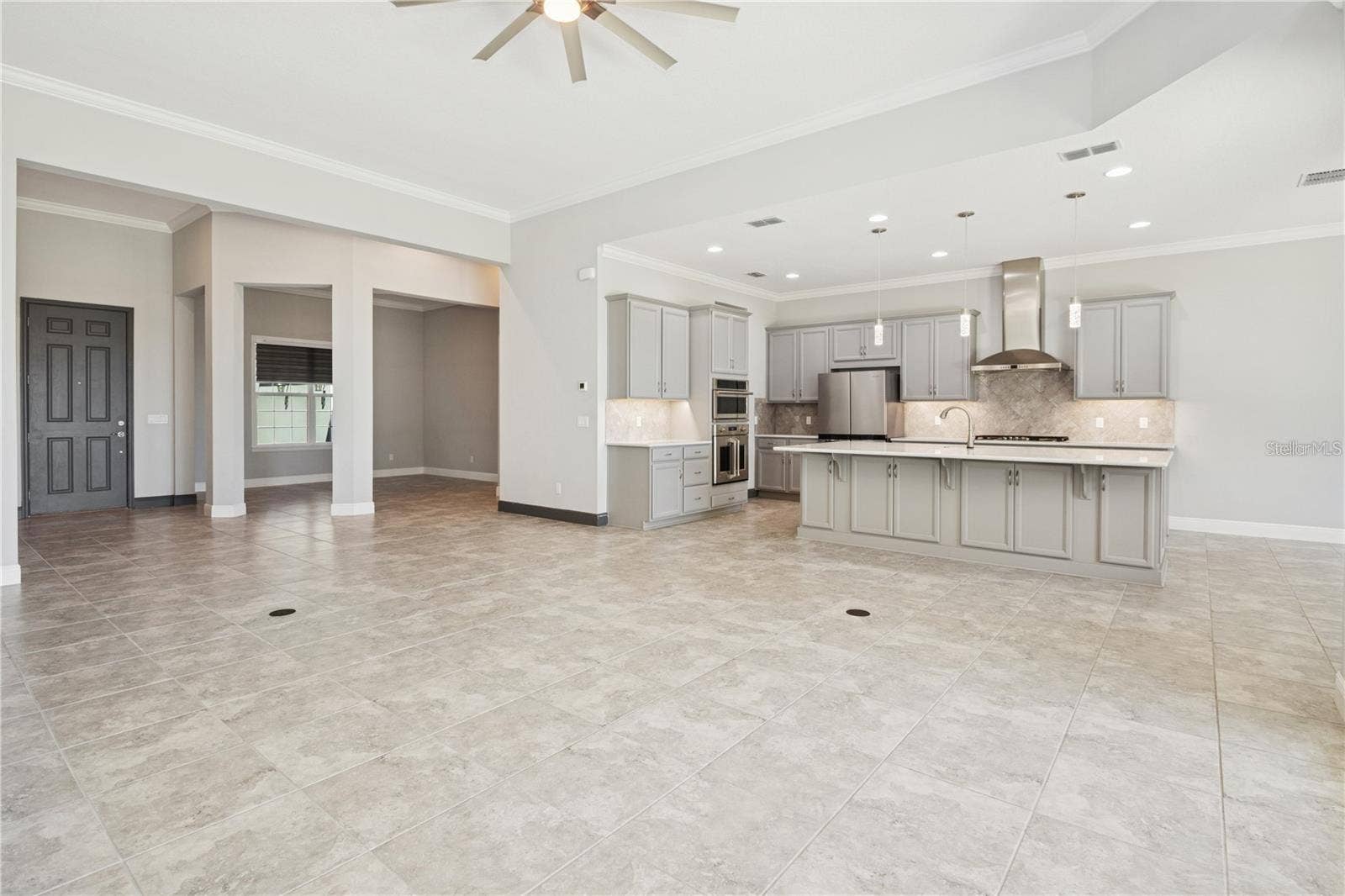 7031 BILLIE COURT, Winter Garden, FL 34787 Great room to kitchen, with formal dining area as well and dinette (not in photo)