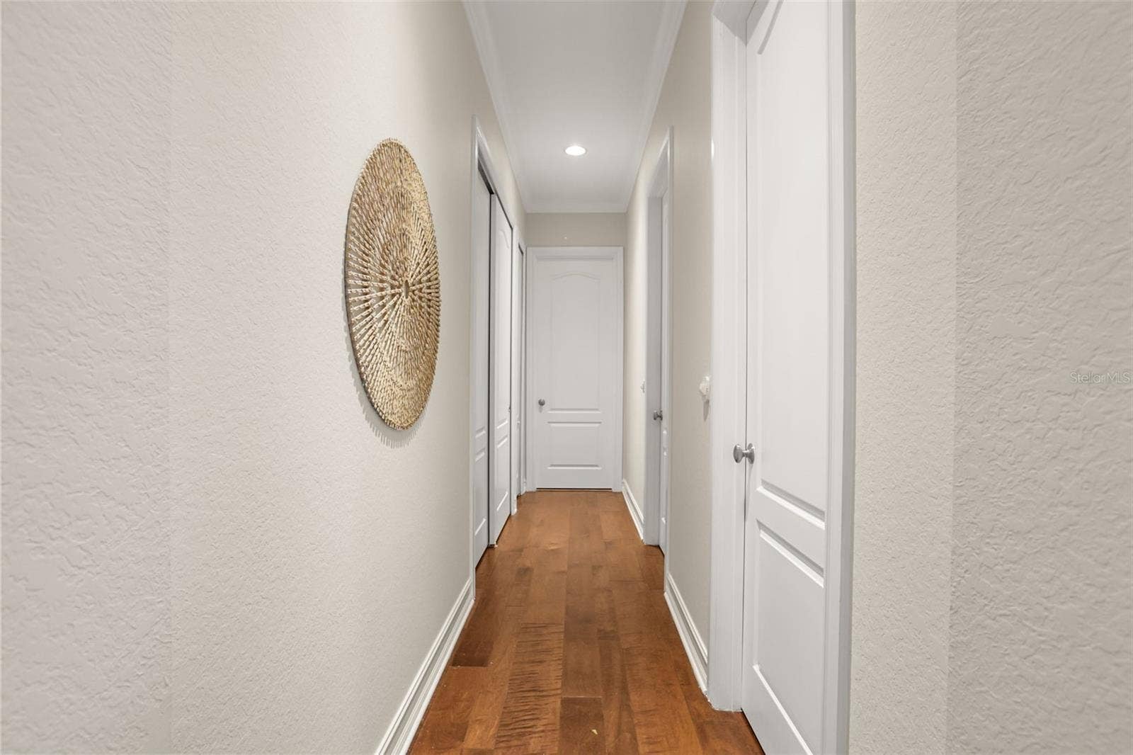 1260 BELLA VISTA CIRCLE, Longwood, FL 32779 Downstairs Primary has 2 walk in closets on the right, 1 full size clothes closet on the left and an additional linen closet on the left, leading to the bathroom