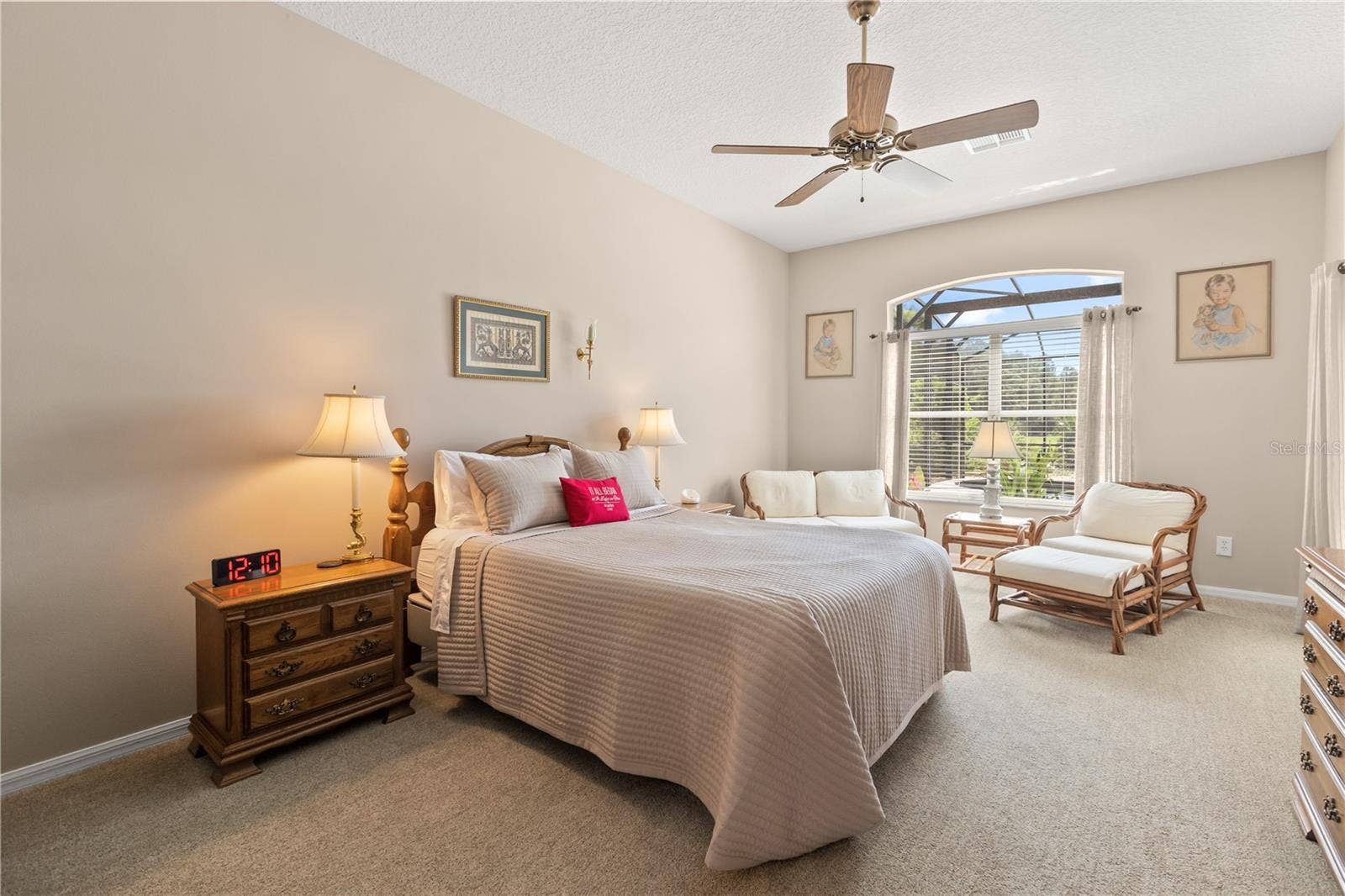 Primary suite featuring dual closets, one serving as a shoe closet