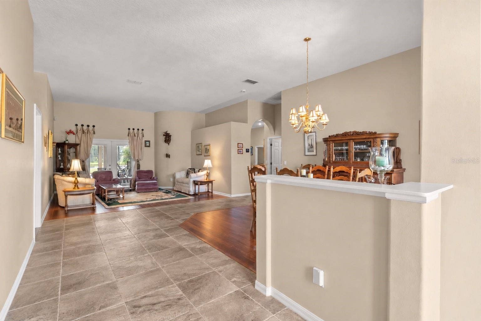Pool view upon entry in the home with oversized foyer