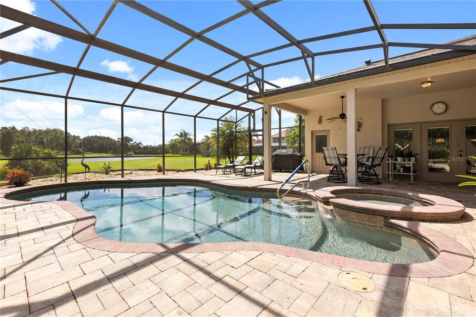 Beautiful pool with gold and pond views on a premium, oversized lot.