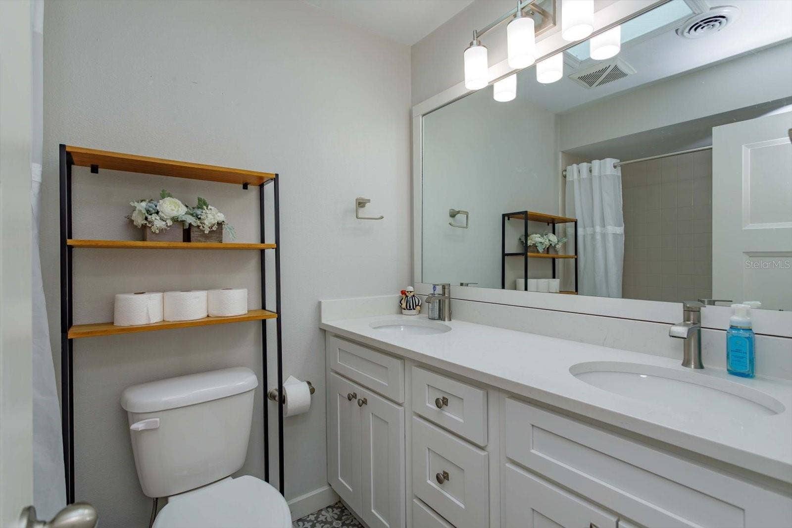 2322 WOODCREST DRIVE, Winter Park, FL 32792 Updated hall bath with dual sinks, shaker cabinets, stone counters and updated fixtures