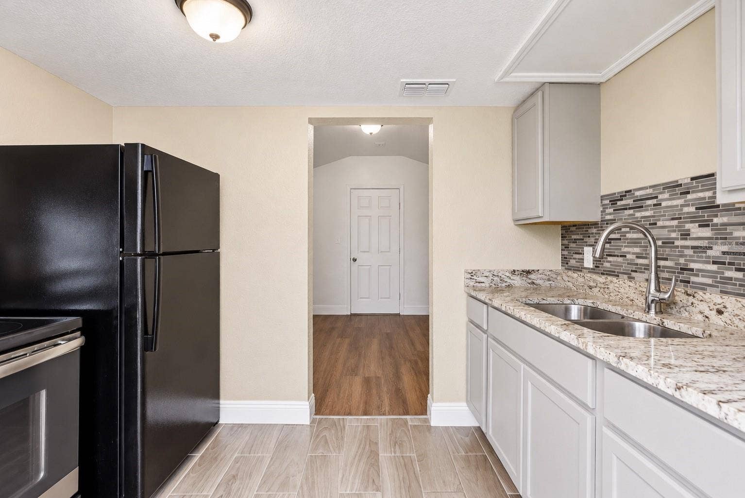 1307 W KALEY AVENUE, Orlando, FL 32805 Virtually Staged Empty