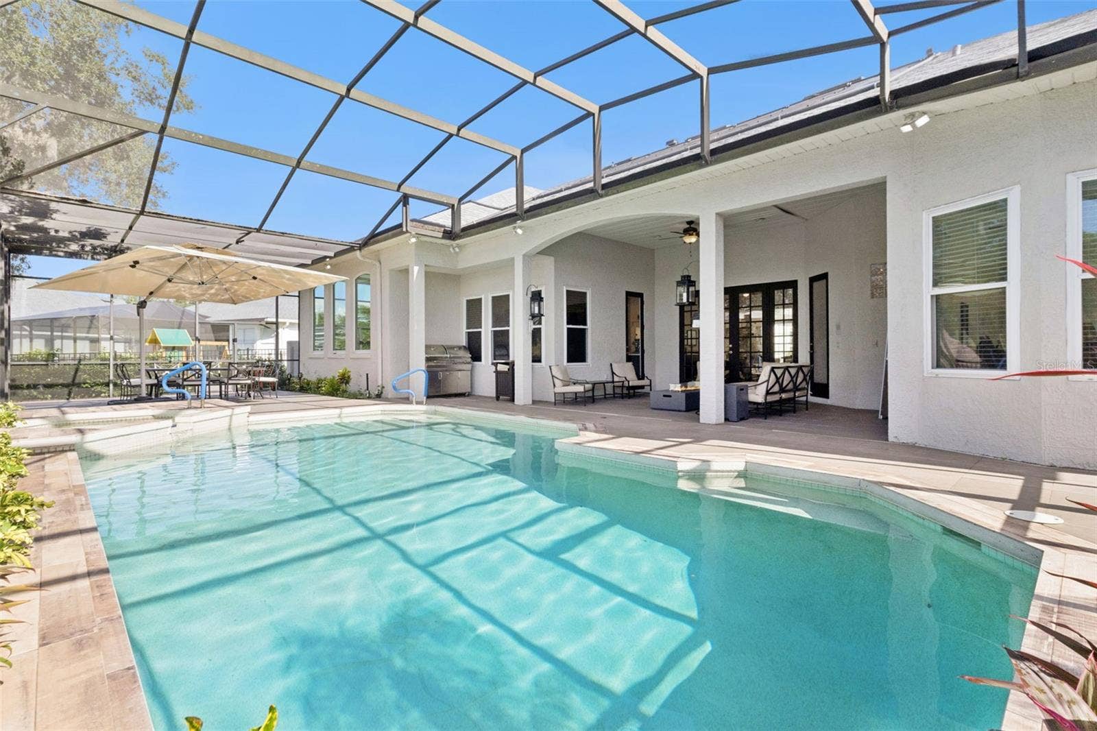3832 HUNTERS ISLE DRIVE, Orlando, FL 32837 Oversized pool/spa area with screen enclosure.