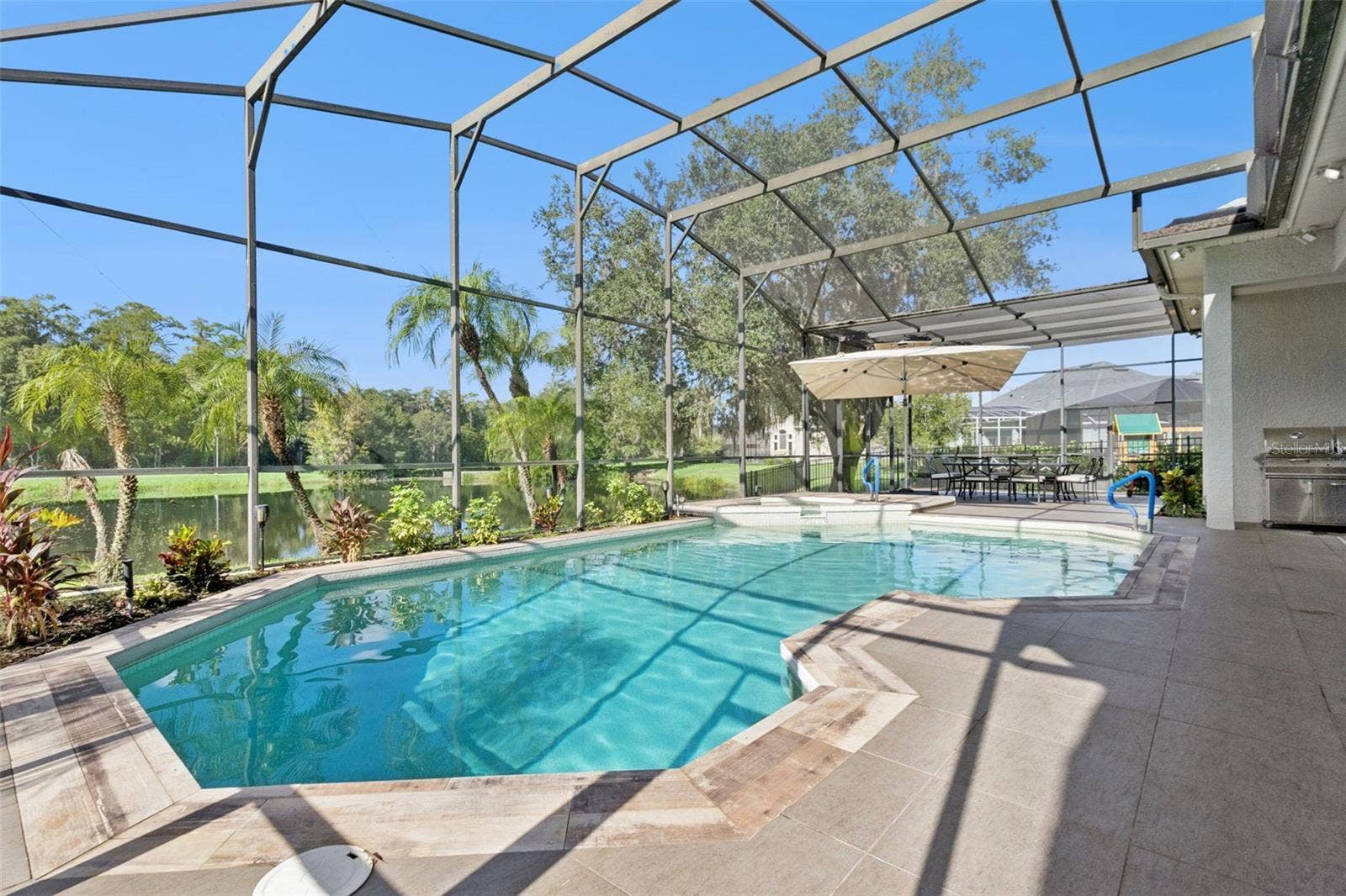 3832 HUNTERS ISLE DRIVE, Orlando, FL 32837 Oversized pool/spa area with screen enclosure - View 3.