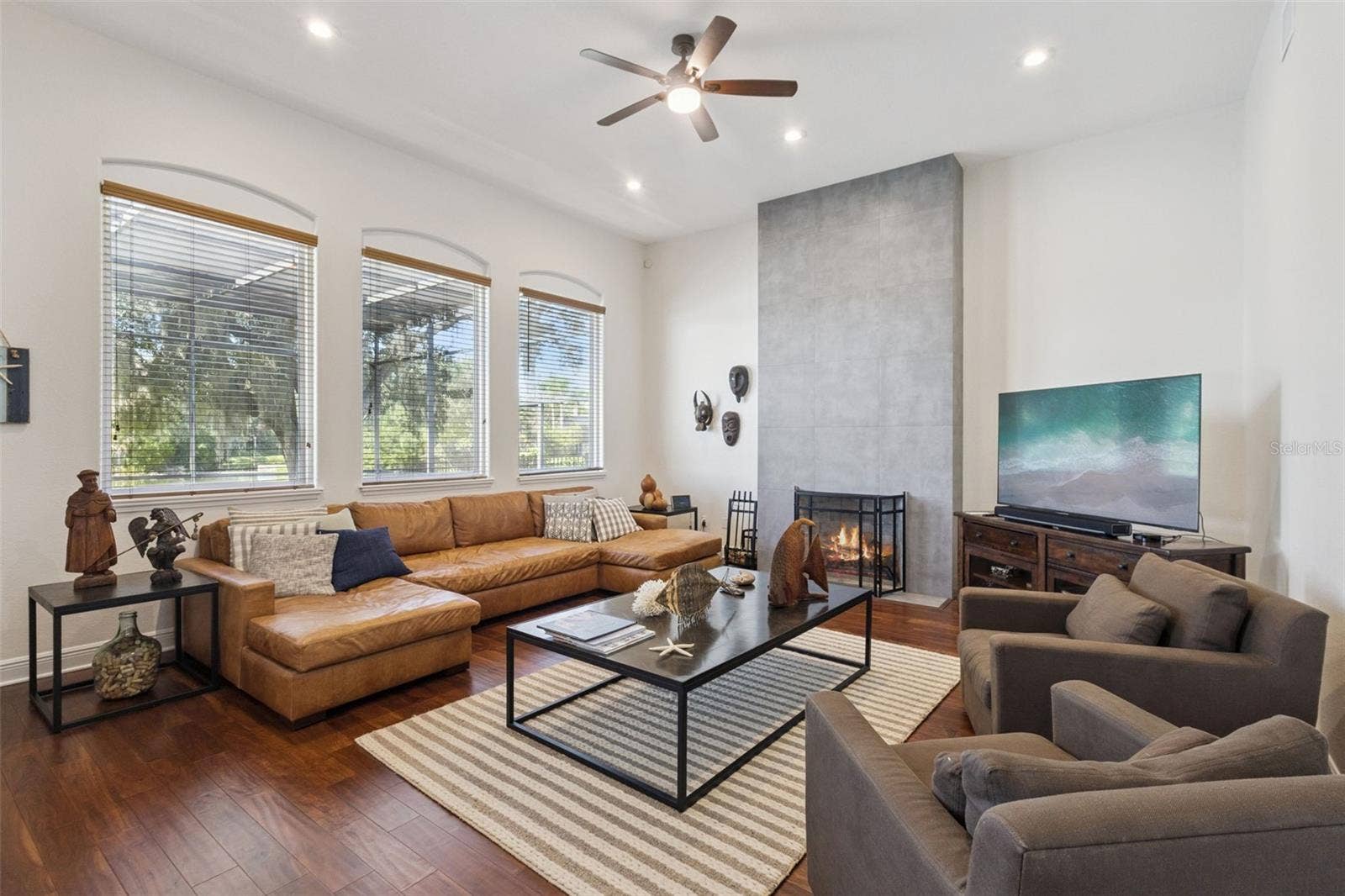 3832 HUNTERS ISLE DRIVE, Orlando, FL 32837 Family room with warming fireplace.
