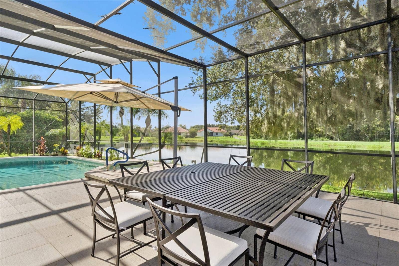 3832 HUNTERS ISLE DRIVE, Orlando, FL 32837 Oversized pool/spa area with screen enclosure - View 4.