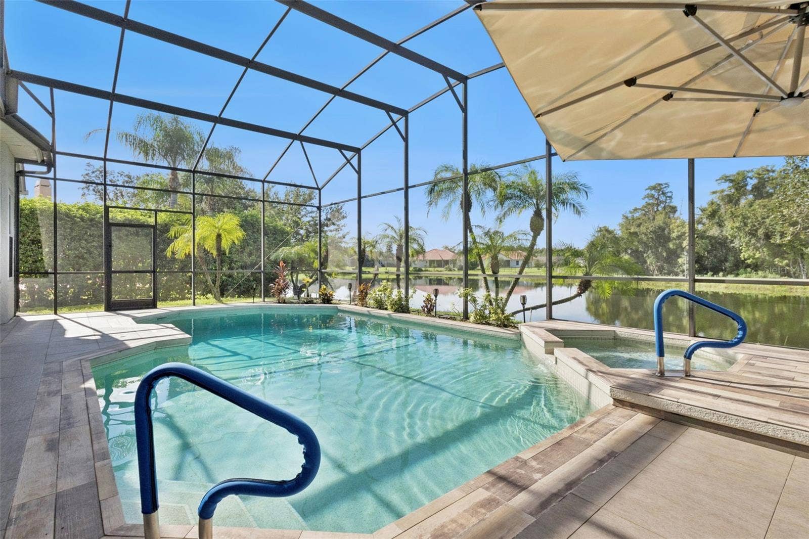 3832 HUNTERS ISLE DRIVE, Orlando, FL 32837 Oversized pool/spa area with screen enclosure - View 2.